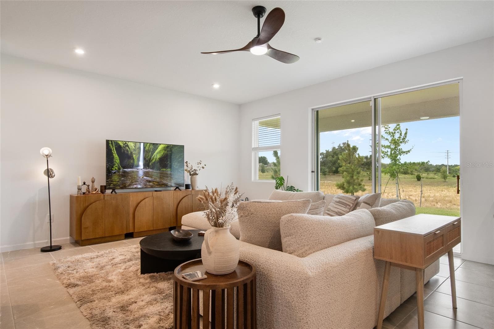 From the great room you notice, No REAR NEIGHBORS peeking in lots of privacy! Very unusual for home sites in Waterbrooke. Very limited no rear neighbor lots. Lets take a look at the covered porch and view. - 2685 SWEET ACACIA DR, CLERMONT