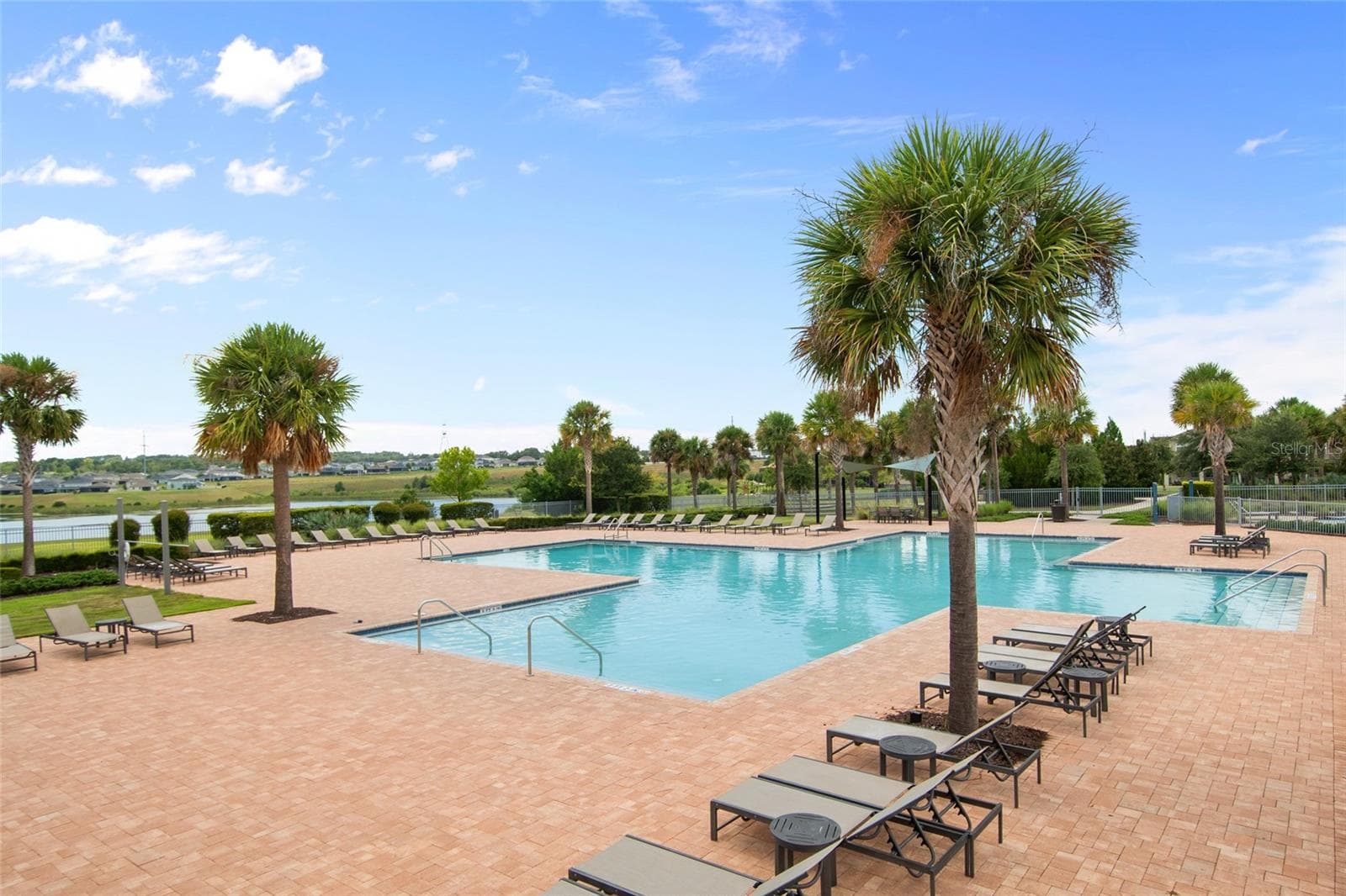 The main pool is oversized and has tons of seating. - 2685 SWEET ACACIA DR, CLERMONT