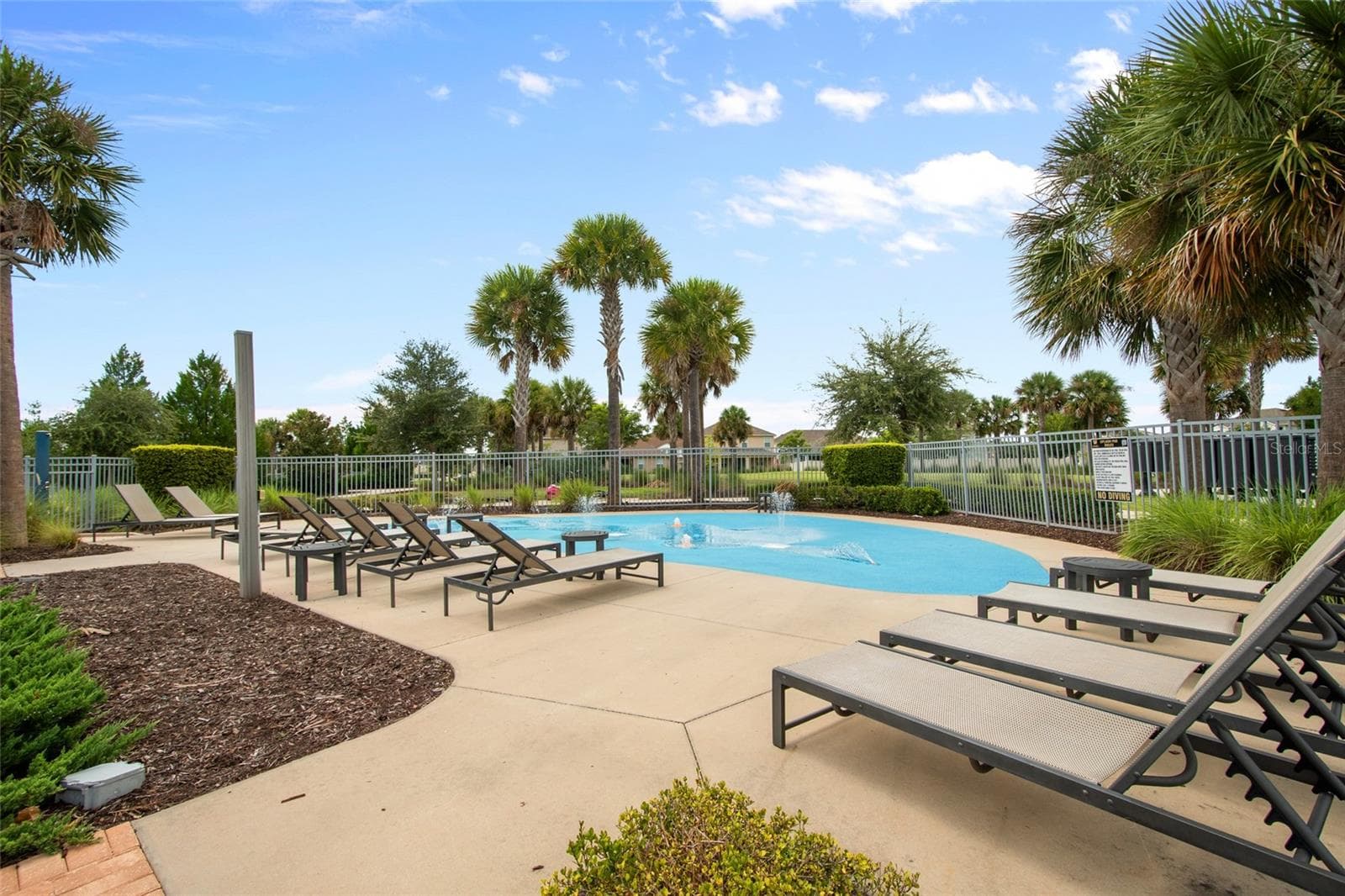 The splash pad is fenced for security - 2685 SWEET ACACIA DR, CLERMONT