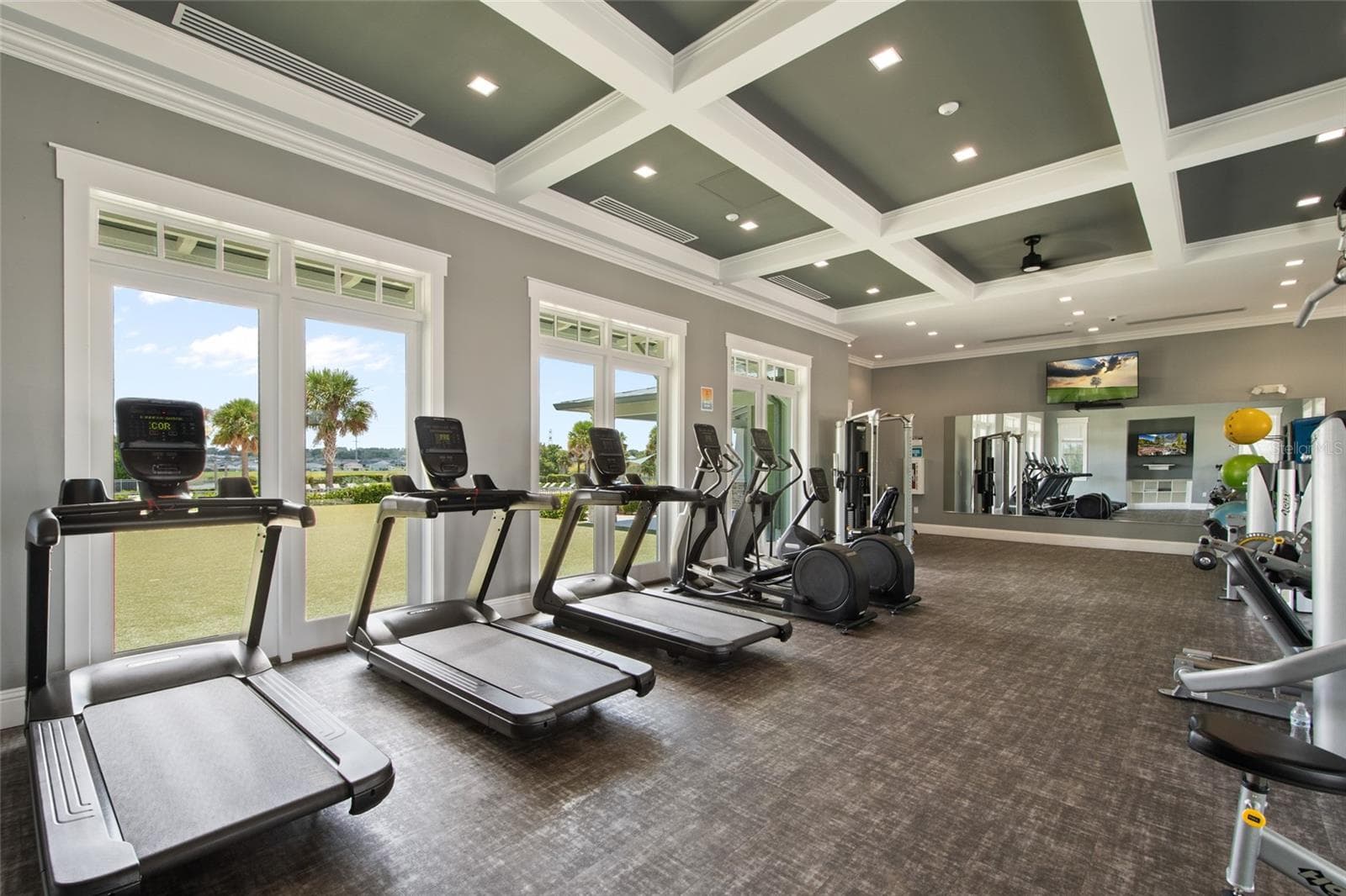 Plenty of newer equipment and an on site manager for questions. Spacious, well lit and has tv's and entertainment while you work out. - 2685 SWEET ACACIA DR, CLERMONT