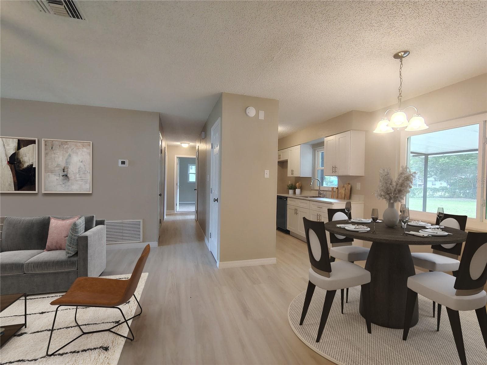 Virtually Staged - Dining Area to Kitchen - 904 HICKORY AVE, FRUITLAND PARK
