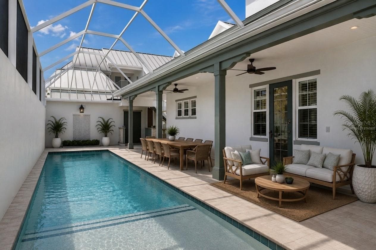 Virtually staged outdoor living oasis featuring spa jets, saltwater caged pool, and access to the ground floor primary bedroom (to the right) - 4024 11TH STREET CT W, PALMETTO