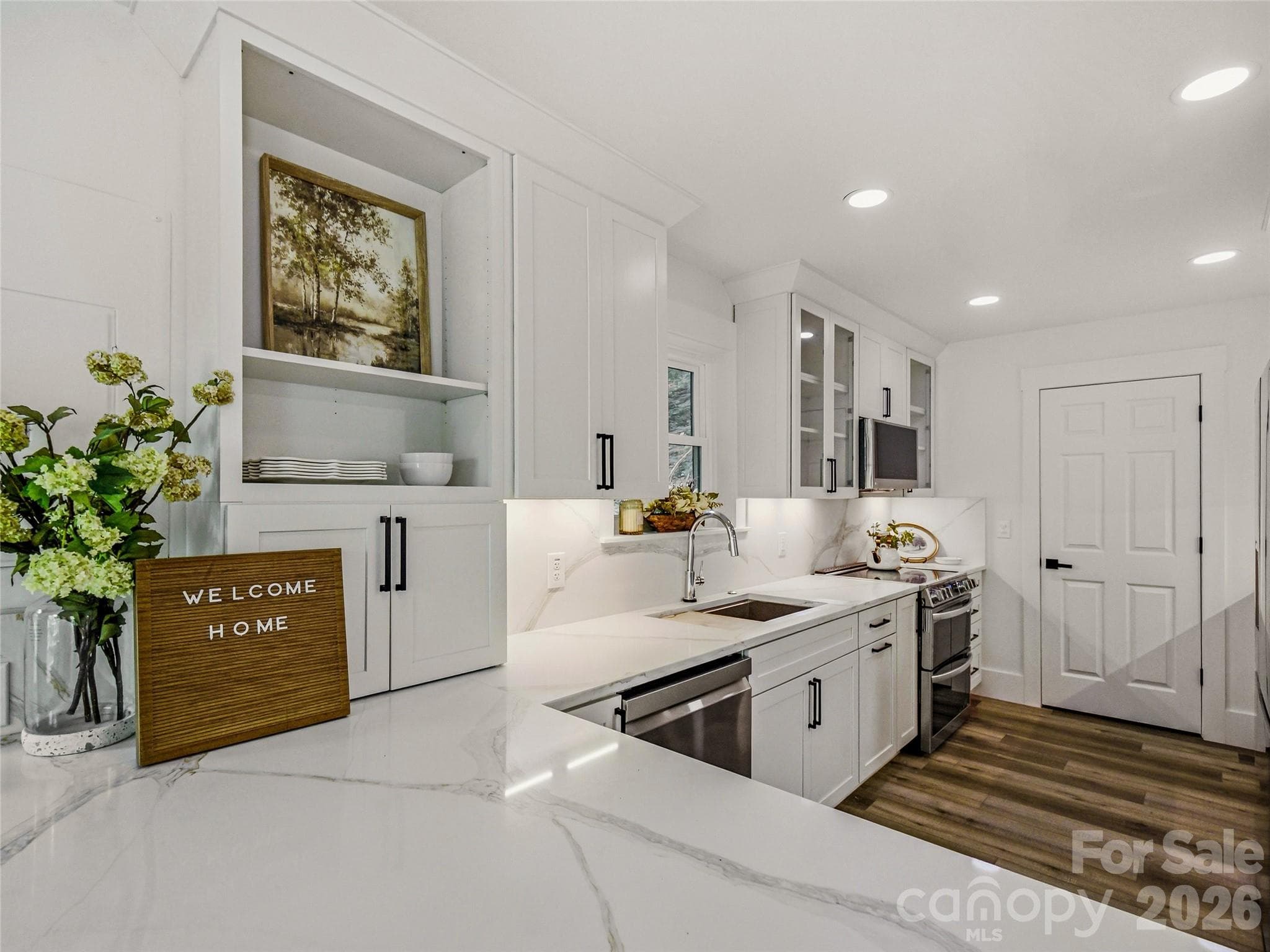 Brand-new kitchen with a bright, fresh look, stylish finishes, generous counter space, and all-new appliances. - 81 Summer Trees Lane, Burnsville