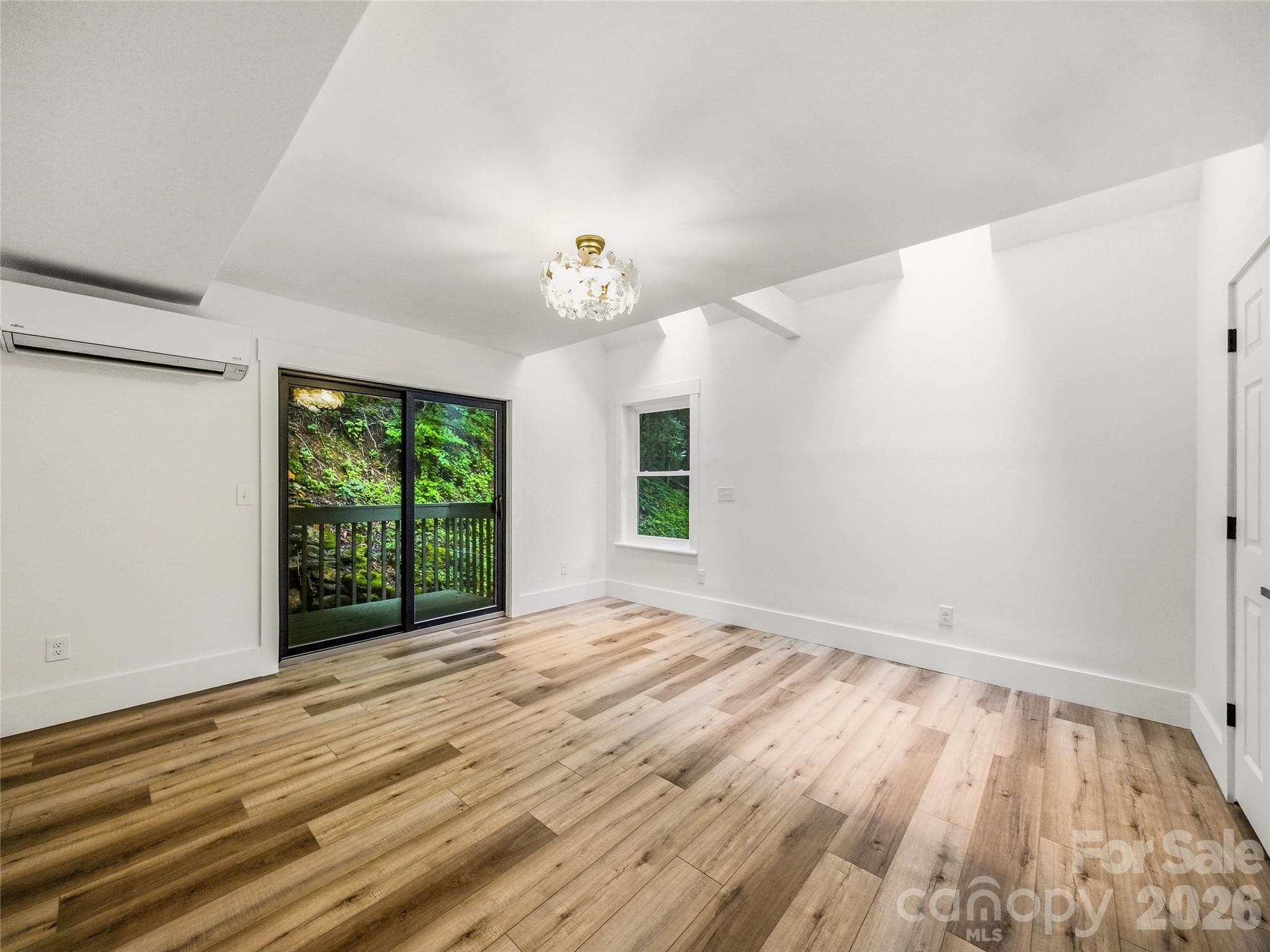 Primary Suite with sitting area, ensuite and double closets.  Skylights and desk adjoin for private enjoyment. - 81 Summer Trees Lane, Burnsville