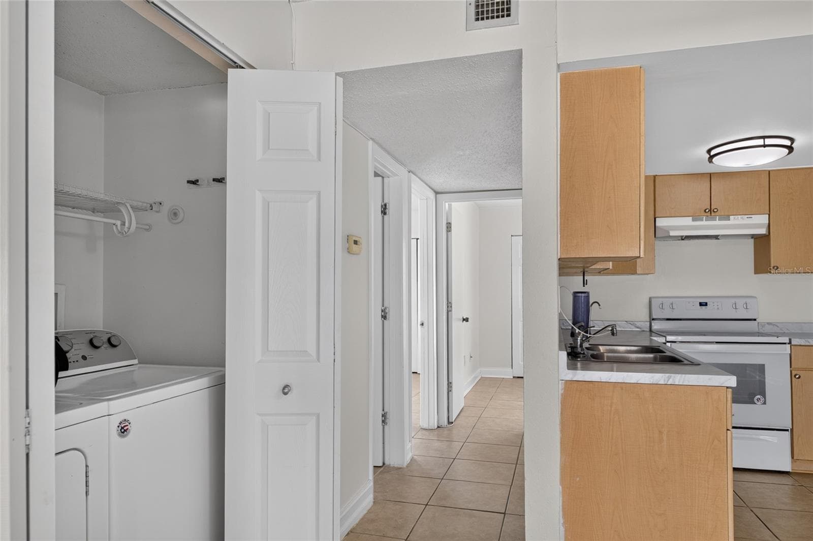 Convenient Laundry Closet with storage - 3461 CLARK RD #160, SARASOTA