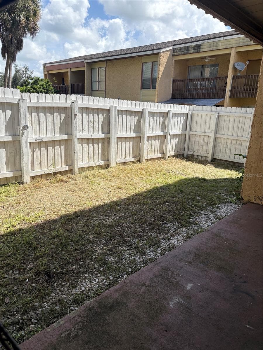 This backyard area can be made into such an amazing space with very little effort - 3461 CLARK RD #160, SARASOTA