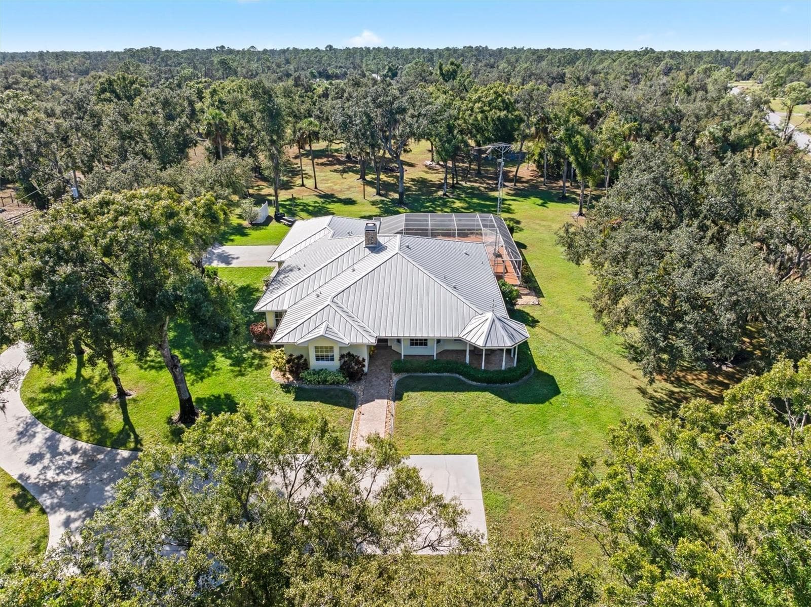 Forward Aerial of house & concrete driveway - NORTH PORT CHARLOTTE ESTATES ADD 02, NORTH PORT