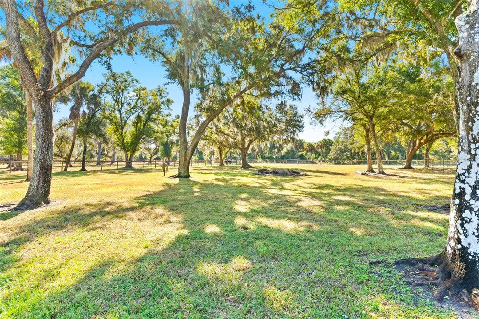 Fenced & cross fenced property with large rock fire pit in rear - NORTH PORT CHARLOTTE ESTATES ADD 02, NORTH PORT