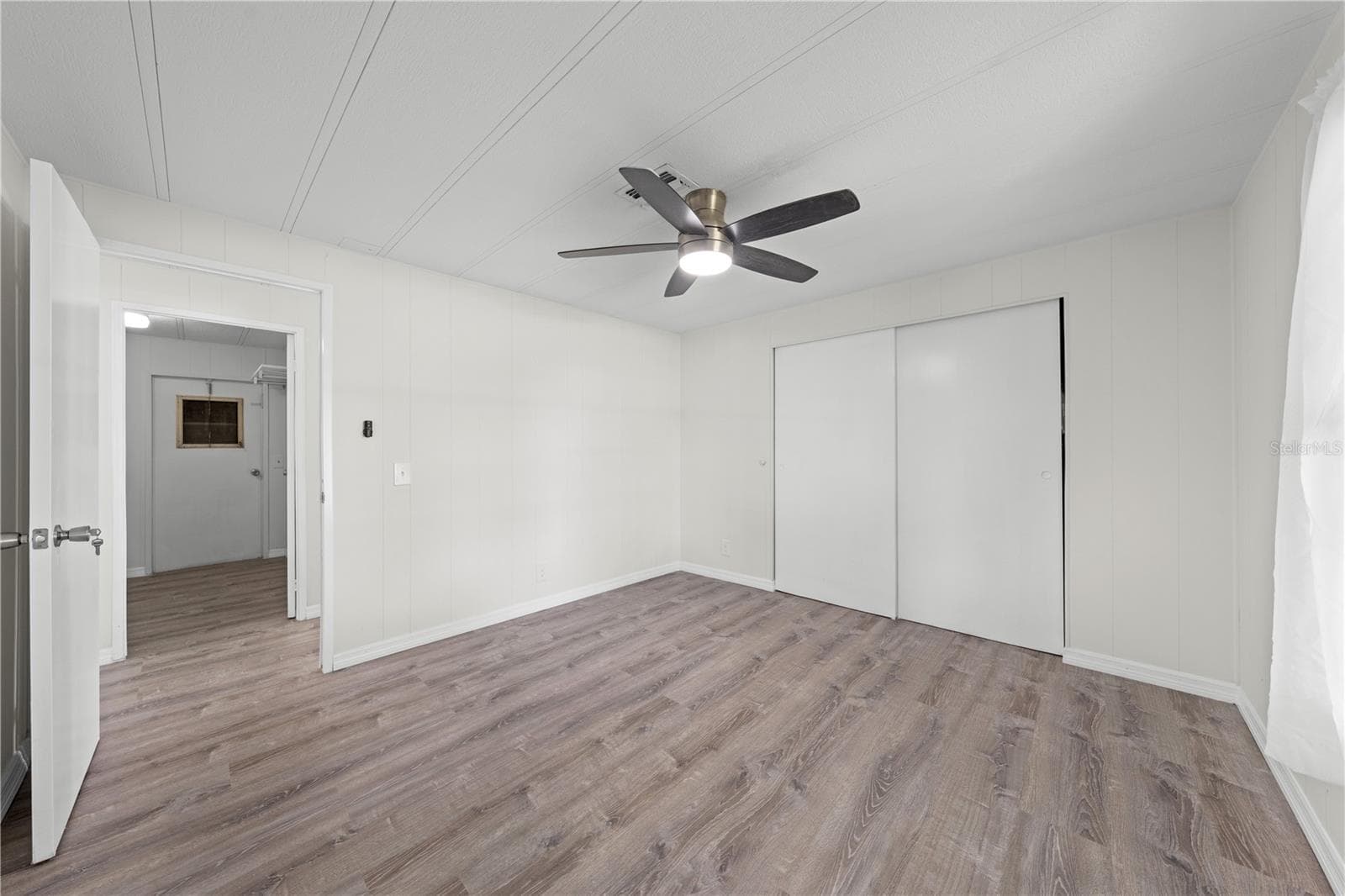 Bedroom 2, across from indoor laundry room - 5601 LAKE LIZZIE DR, ST CLOUD
