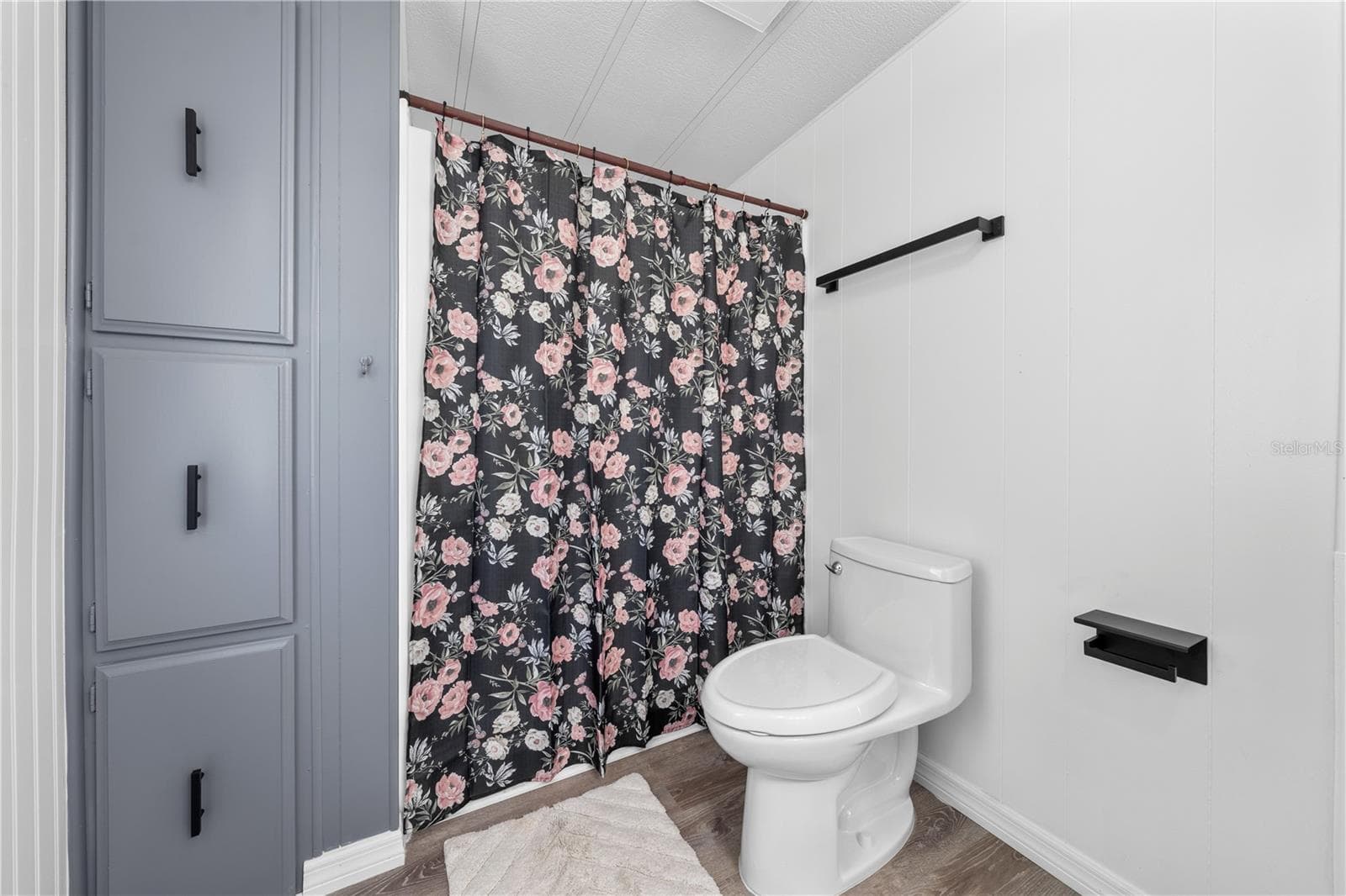 Shower, new fixtures and another floor to ceiling storage cabinet. - 5601 LAKE LIZZIE DR, ST CLOUD