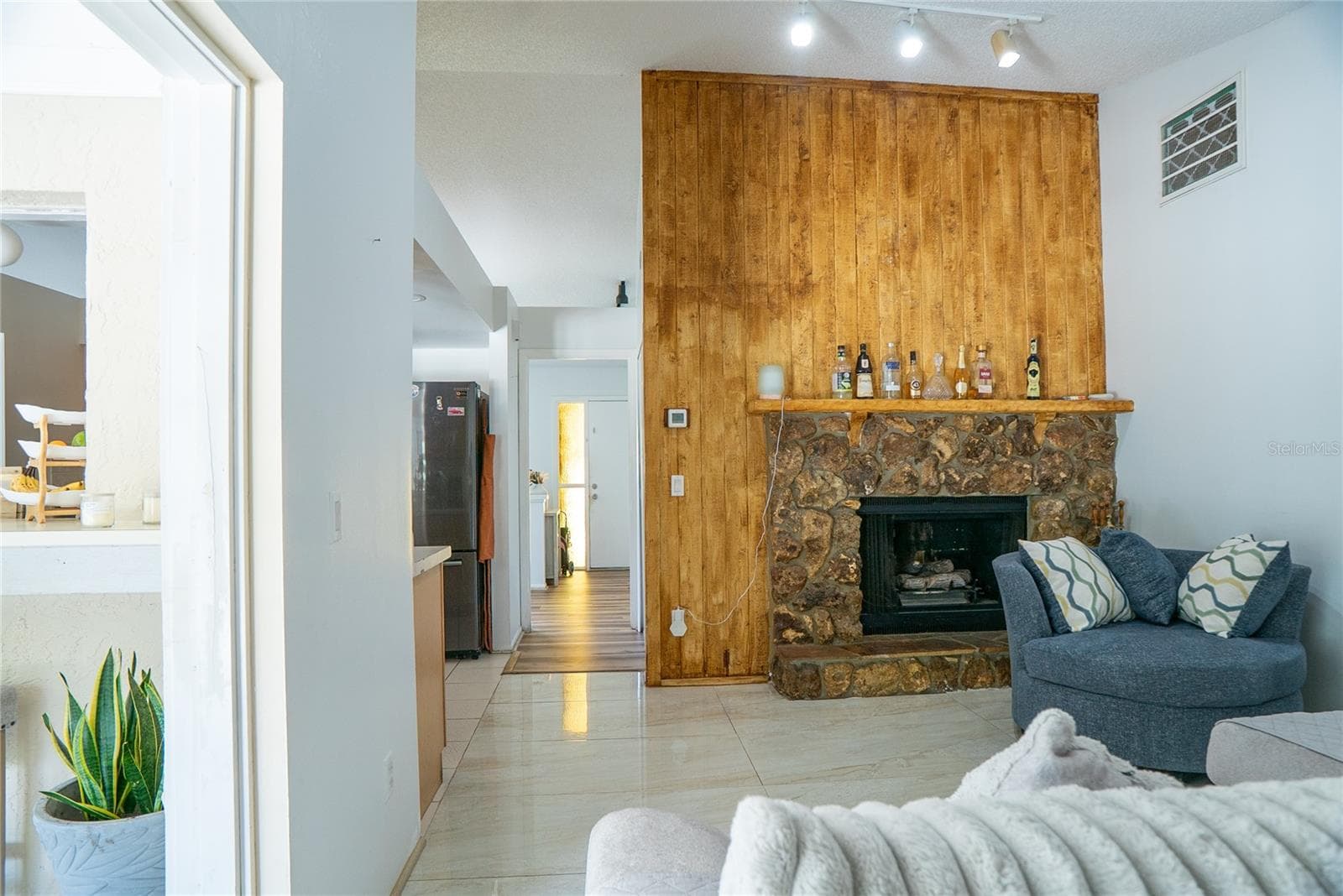 Fireplace at 304 Shadow Oak Drive, adding warmth and character to this four-bedroom pool home in Casselberry, Florida - 304 SHADOW OAK DR, CASSELBERRY
