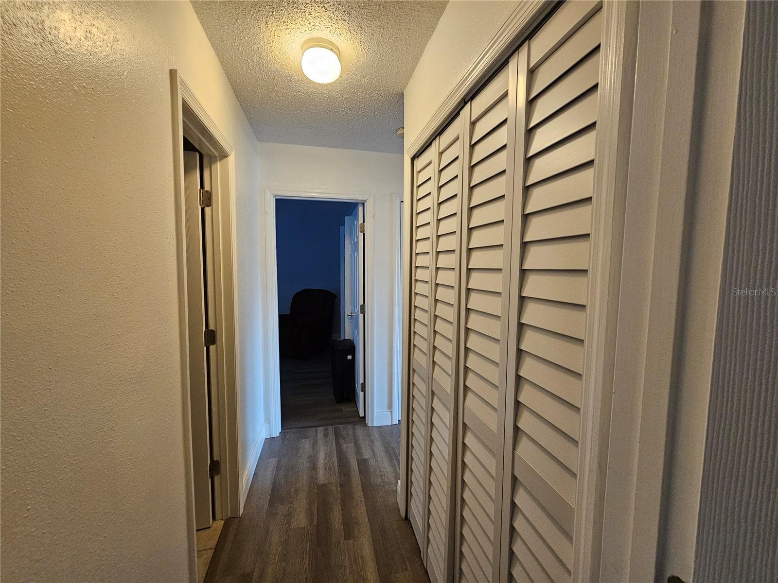 Hallway Between Bedrooms with 2nd Bathroom and Laundry Closet - 1737 PARAKEET WAY #609, SARASOTA