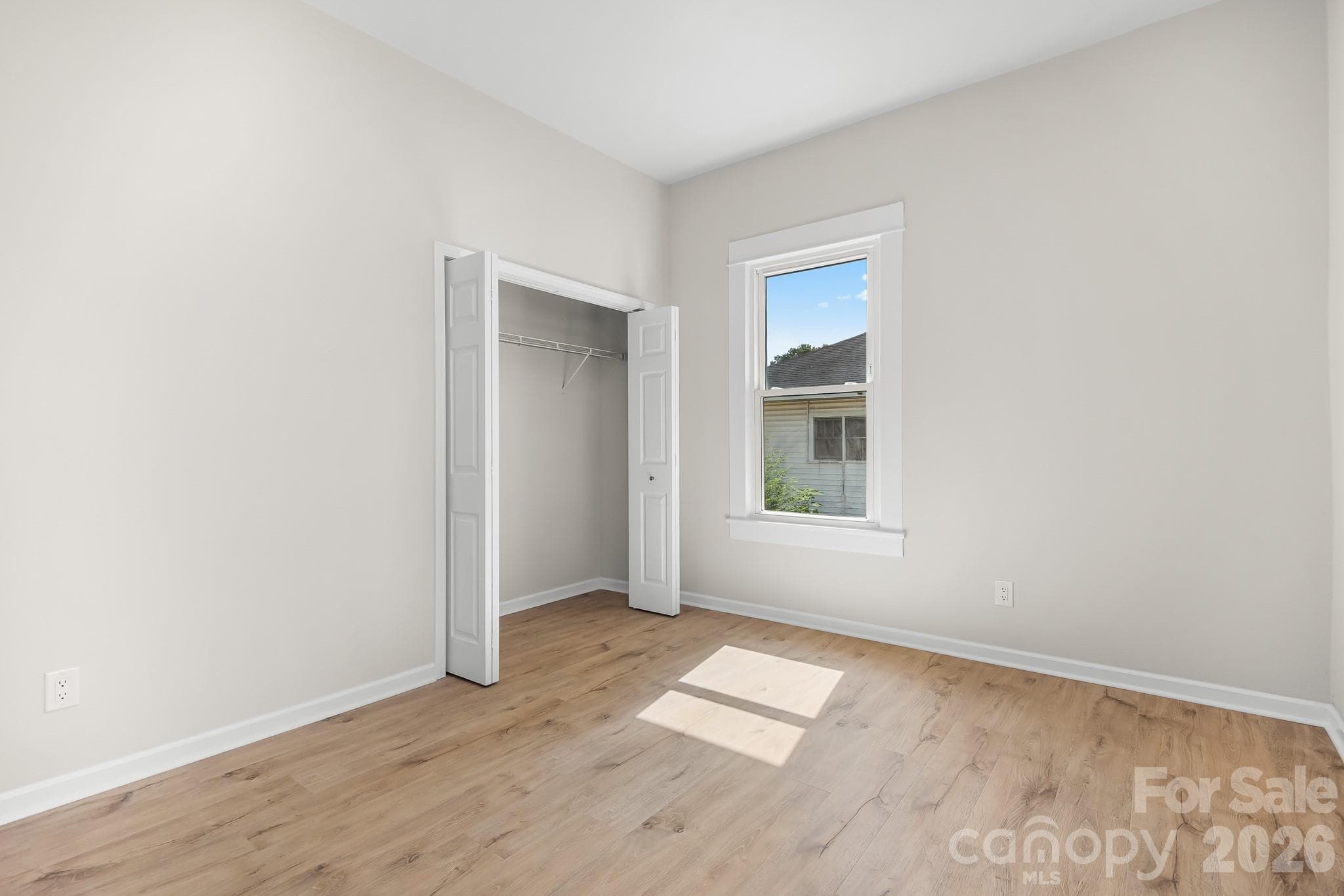 Bedroom 1. Bright bedroom with a spacious closet and natural light - 104 1st Avenue, China Grove