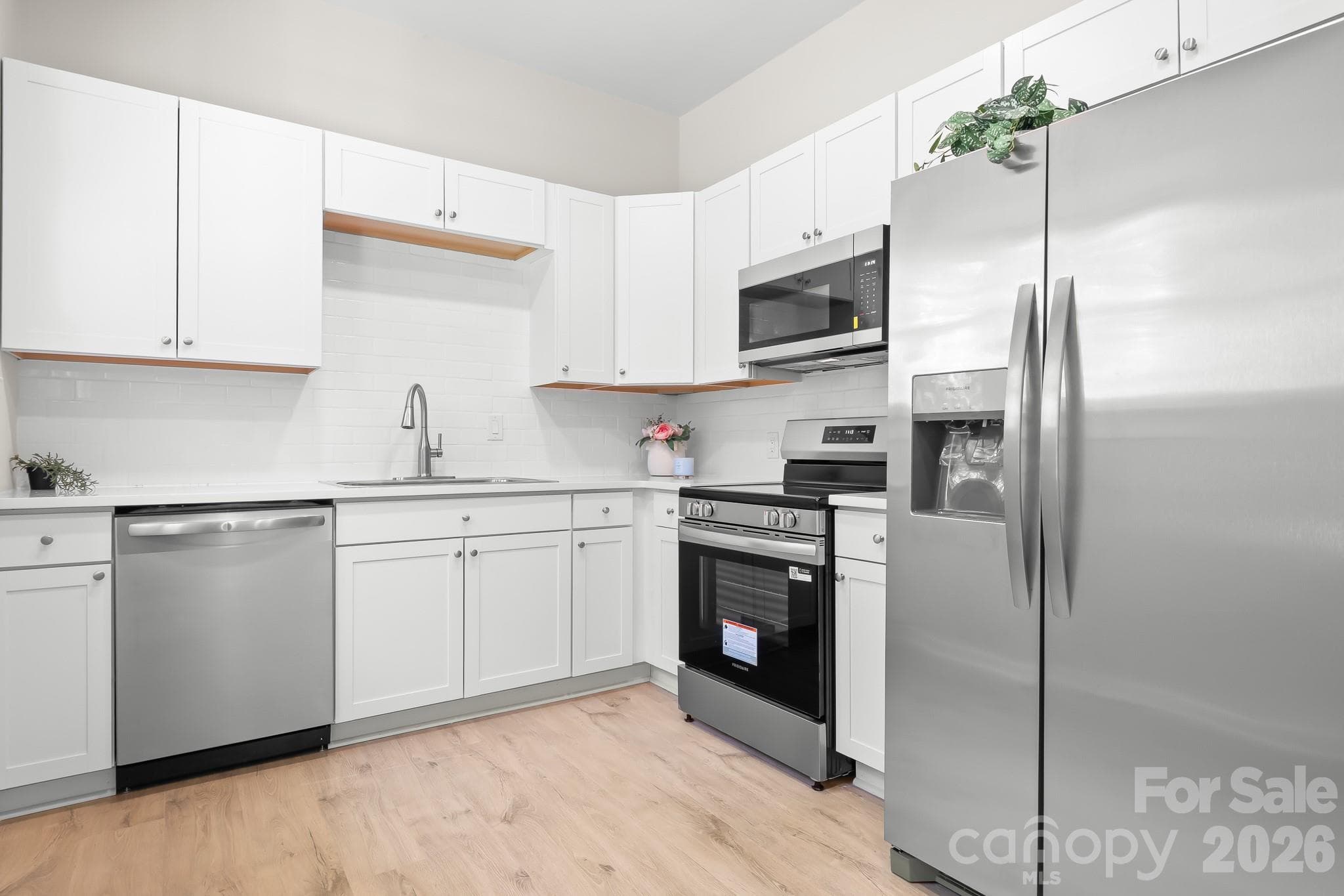 Bright kitchen with brand-new stainless steel appliances. - 104 1st Avenue, China Grove