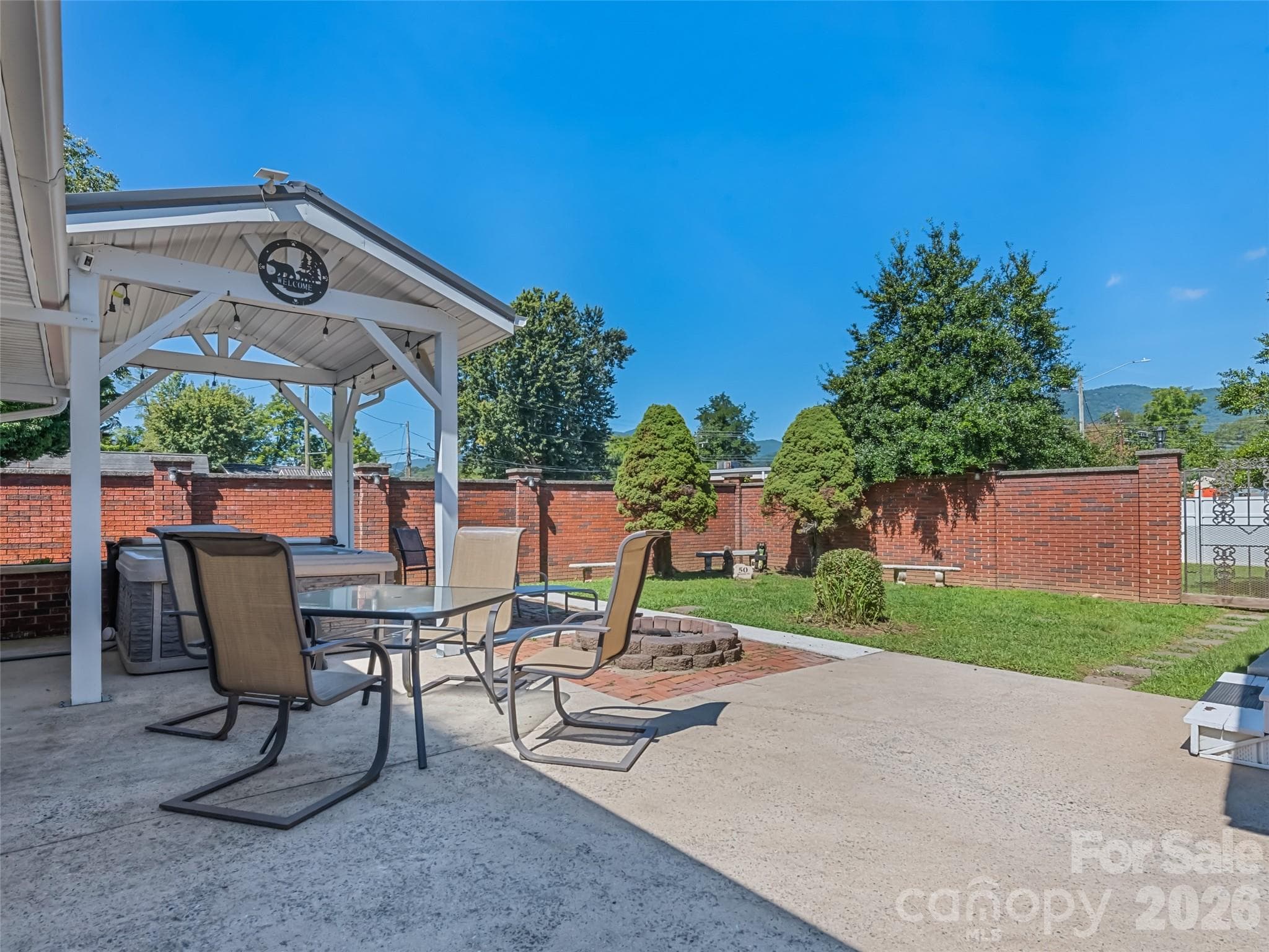 Rear Courtyard with fire pit and hot tub - 50 Epsom Street, Waynesville