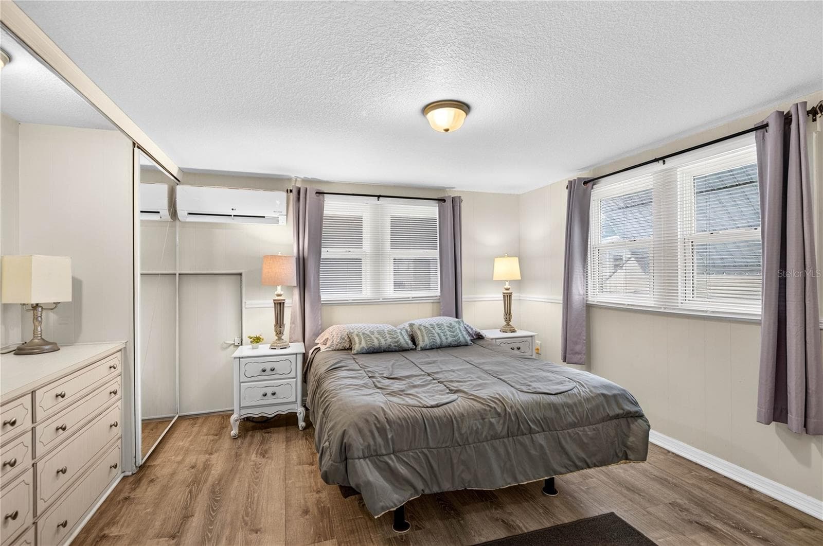 Primary bedroom with built in chest of drawers. - 2000 E BAY DR #33, LARGO