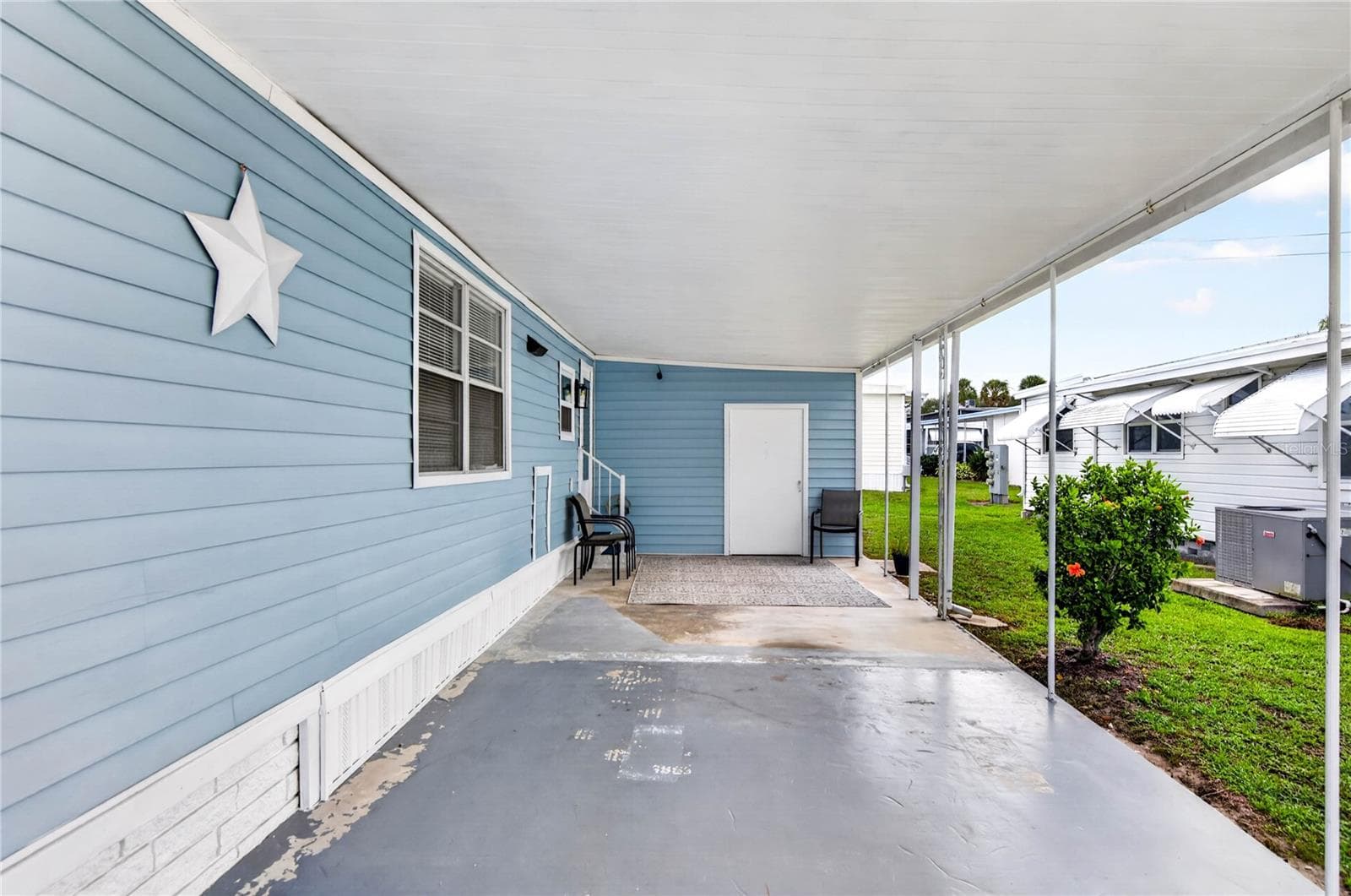 Long carport, room for 2 cars to be covered. - 2000 E BAY DR #33, LARGO