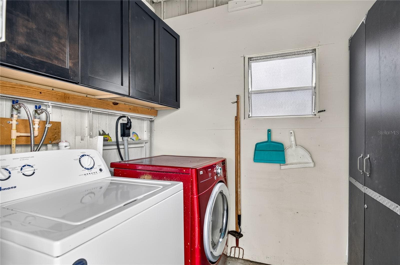 Washer/dryer included inside the shed in carport. - 9900 ULMERTON RD #28, LARGO