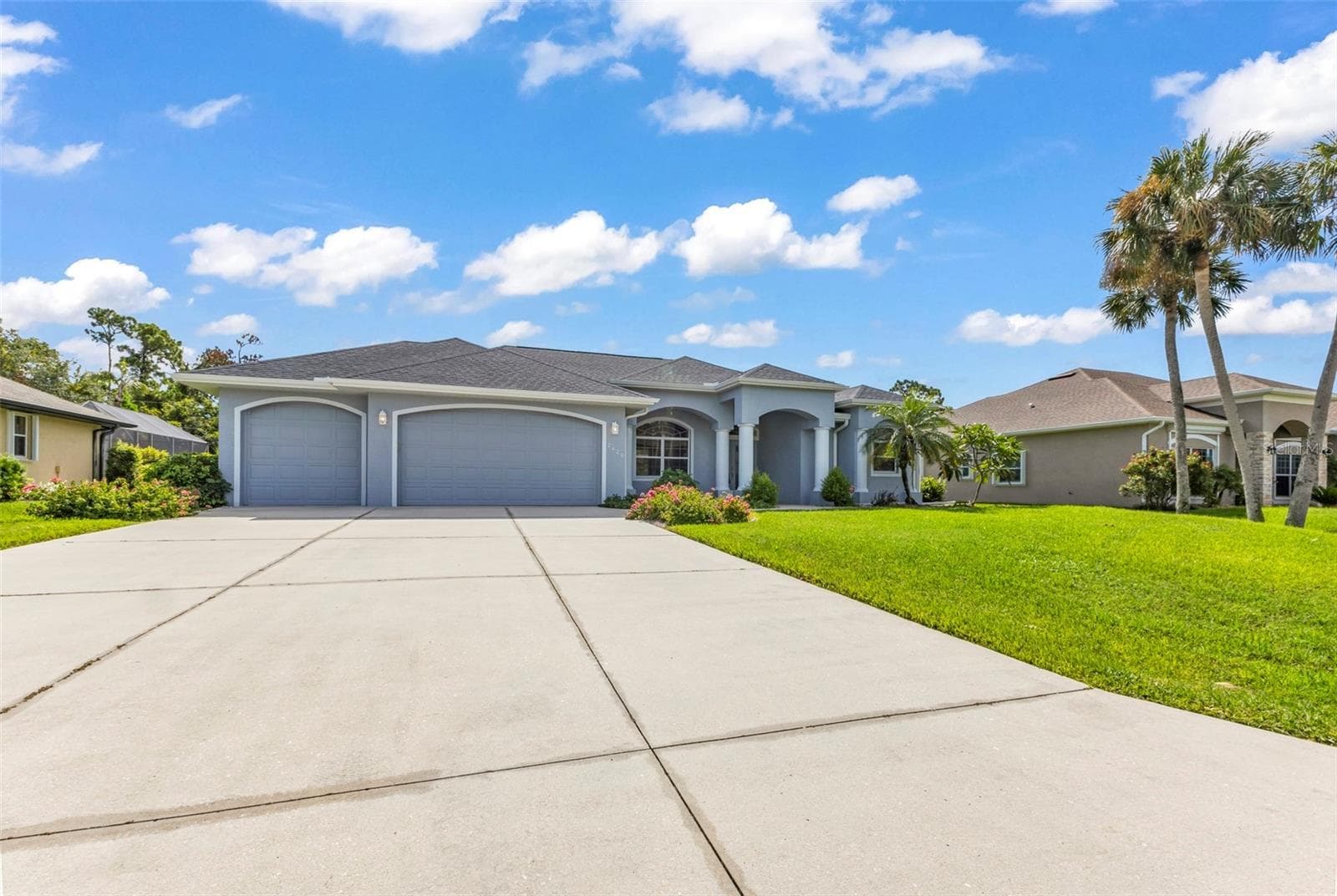 Large driveway 3 car garage - 2420 PEBBLE CREEK PL, PORT CHARLOTTE