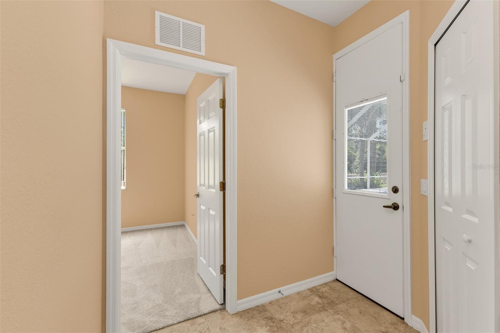 Guest hallway to pool and linen closet - 2420 PEBBLE CREEK PL, PORT CHARLOTTE