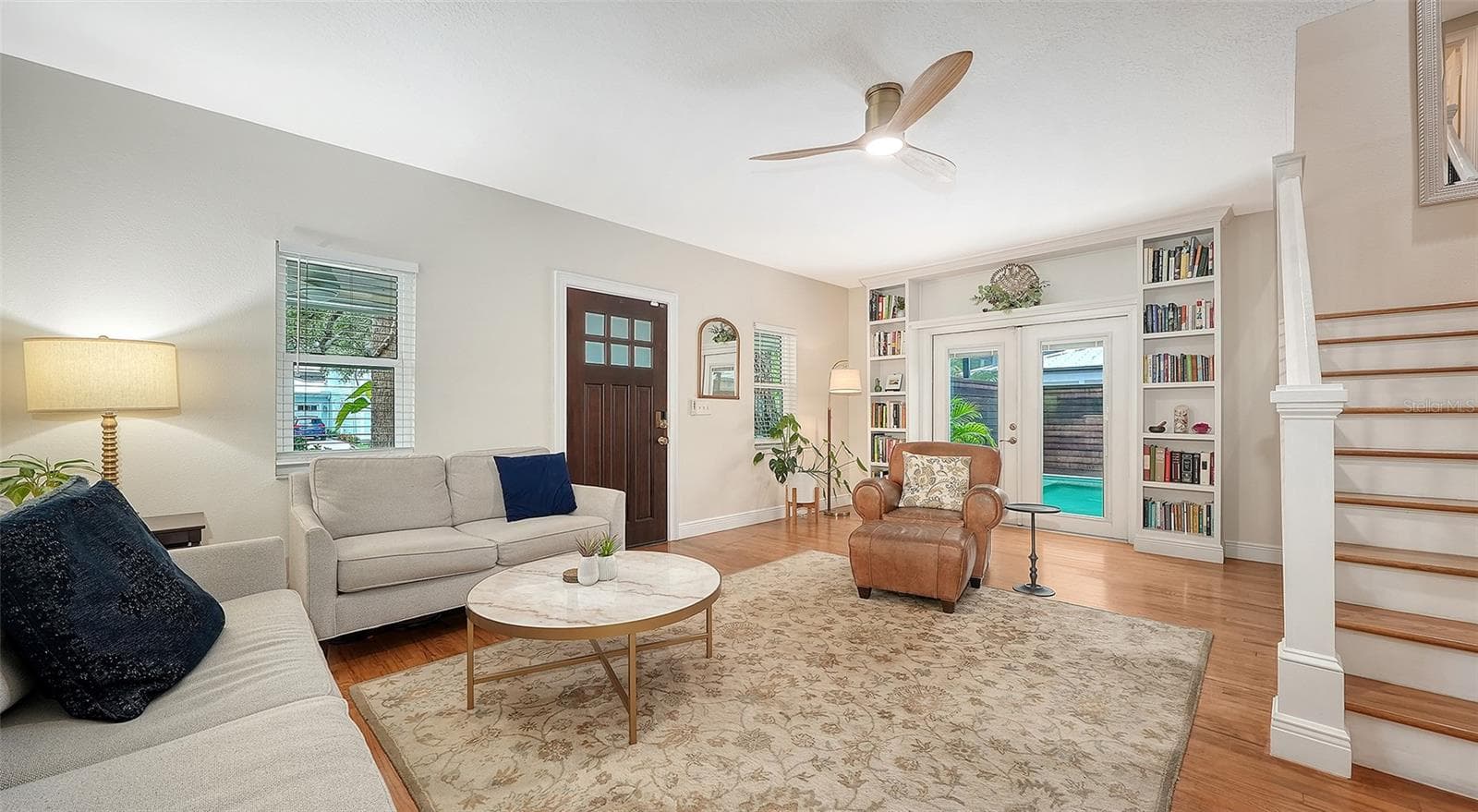 Open-concept living space showcases elegant finishes, generous proportions, and seamless connection to the home’s private outdoor setting. - 1685 6TH ST, SARASOTA