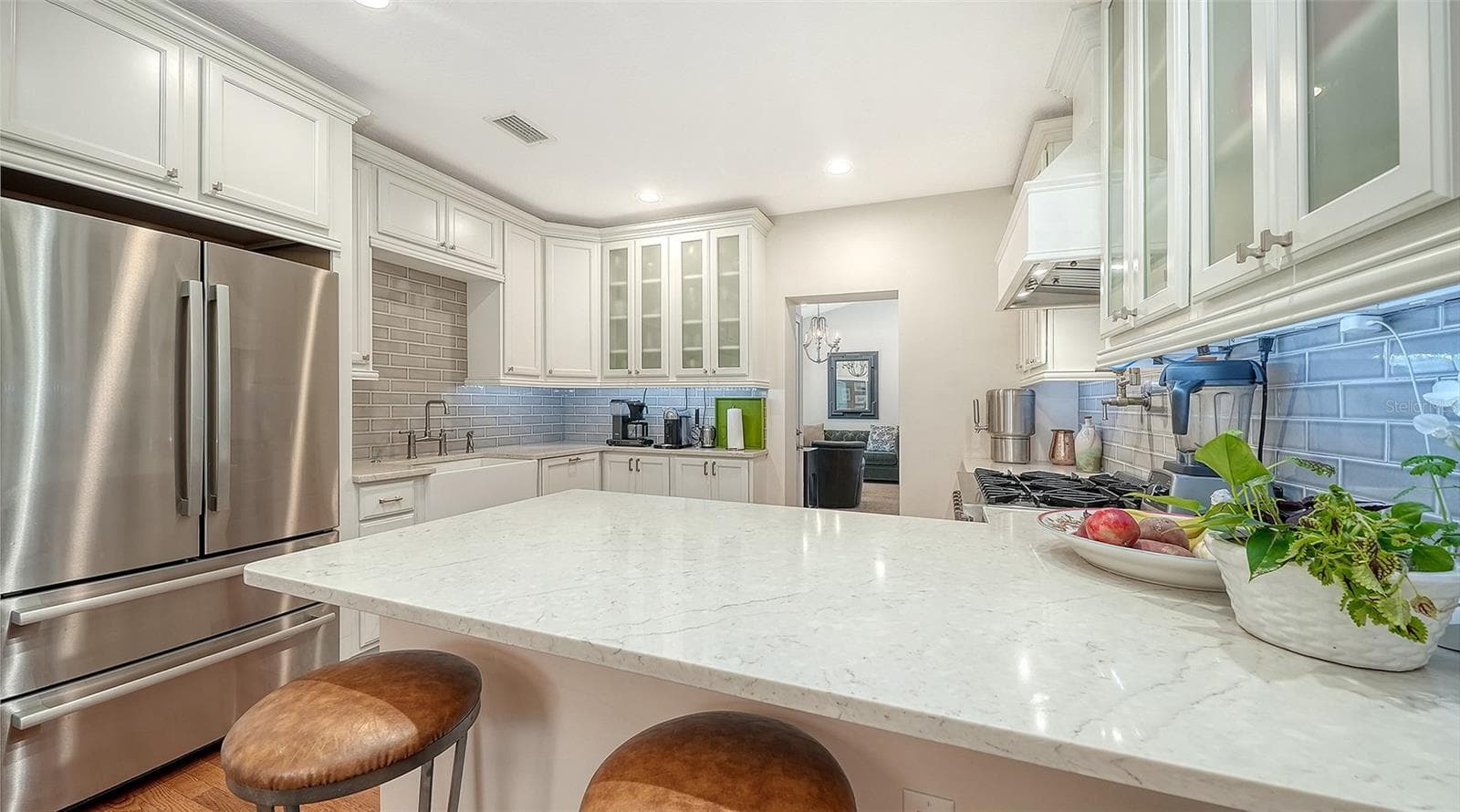 Beautifully appointed chef’s kitchen offers abundant custom cabinetry, premium appliances, quartz countertops, and exceptional workspace. - 1685 6TH ST, SARASOTA
