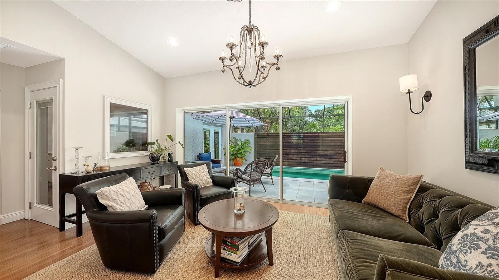 Elegant bonus area provides flexible living space with generous proportions, natural light, and seamless access to the private outdoor retreat. - 1685 6TH ST, SARASOTA