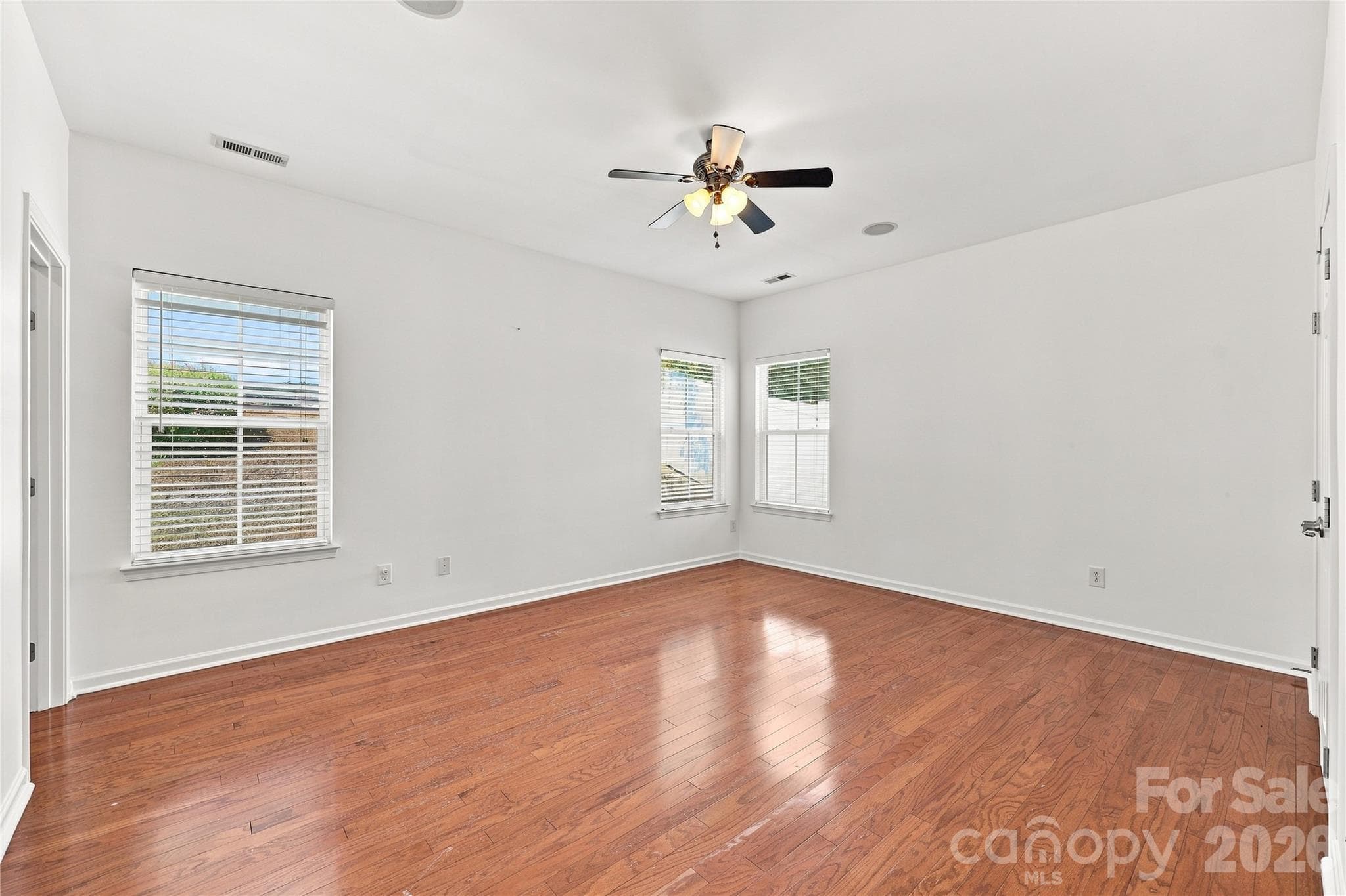 Primary bedroom with ceiling fan - 593 Harrison Drive NW, Concord