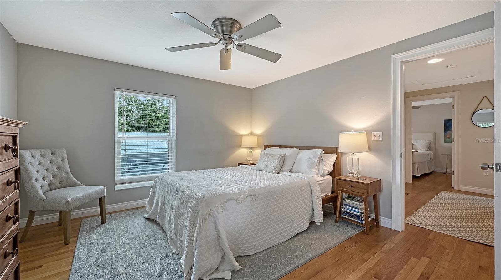 Spacious bedroom offers hardwood floors, abundant natural light, and a serene setting suitable for a luxurious private retreat. - 1685 6TH ST, SARASOTA