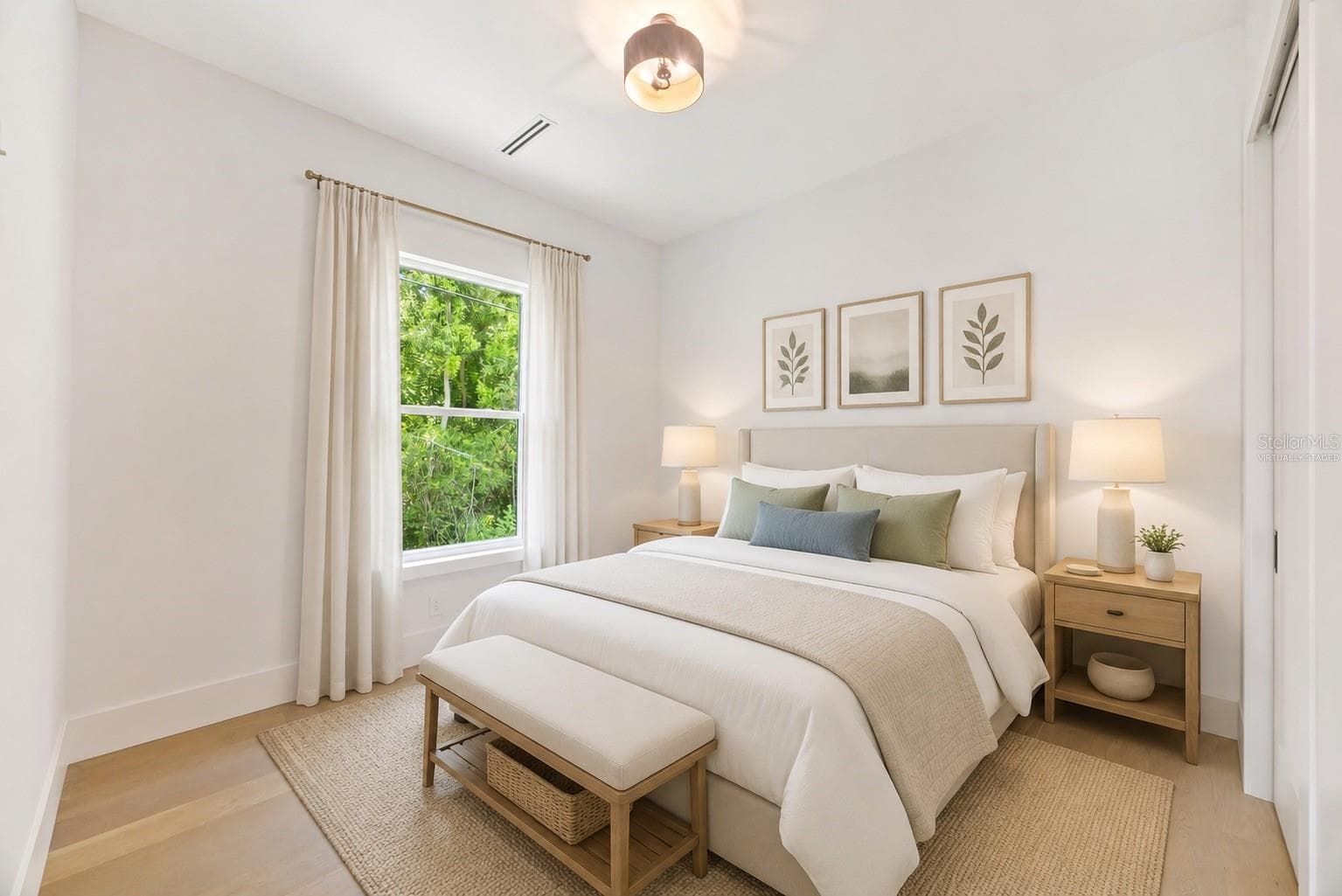 Virtually staged Bedroom 4 enjoys a private en-suite bath with direct exterior access to the lanai, providing an ideal guest retreat and future pool bath. - 1336 HAYS RD, TARPON SPRINGS