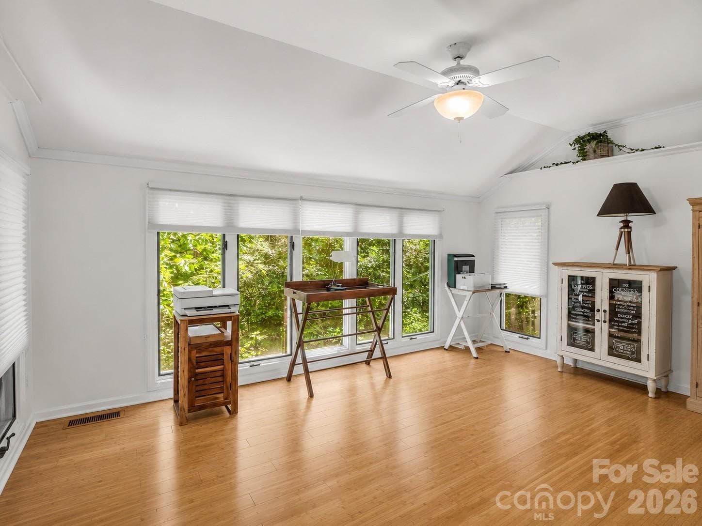 Walls of windows in sunroom with shades - 335 Melrose Avenue, Tryon