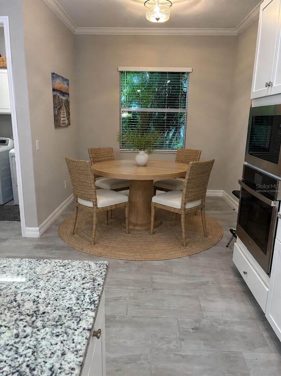Virtually staged breakfast nook furnished - 11825 PERENNIAL PL, BRADENTON