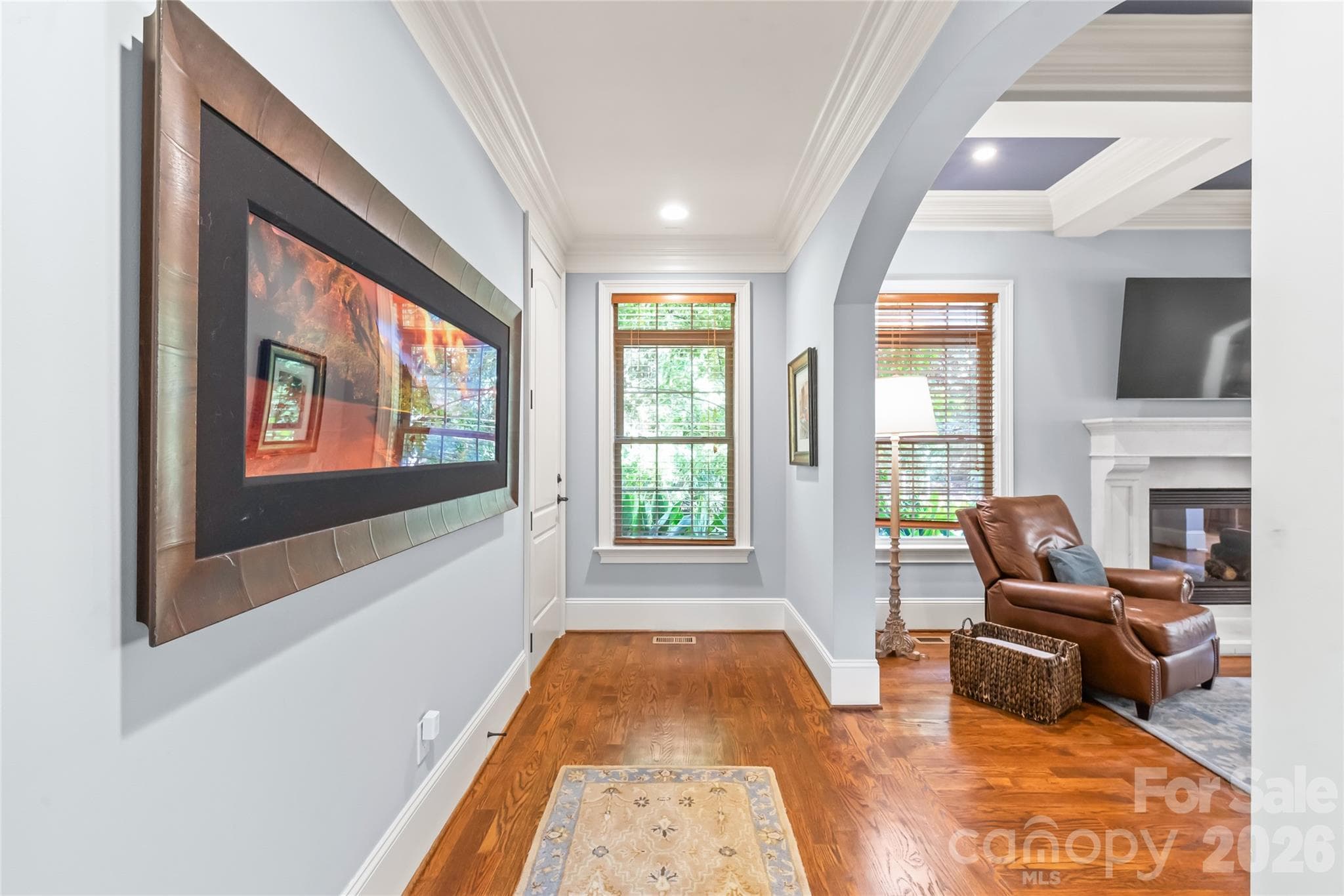 High-profile baseboards add a tall, custom look throughout the home, creating an atmosphere of grand proportions and tailored sophistication. - 7320 Summerlin Place, Charlotte
