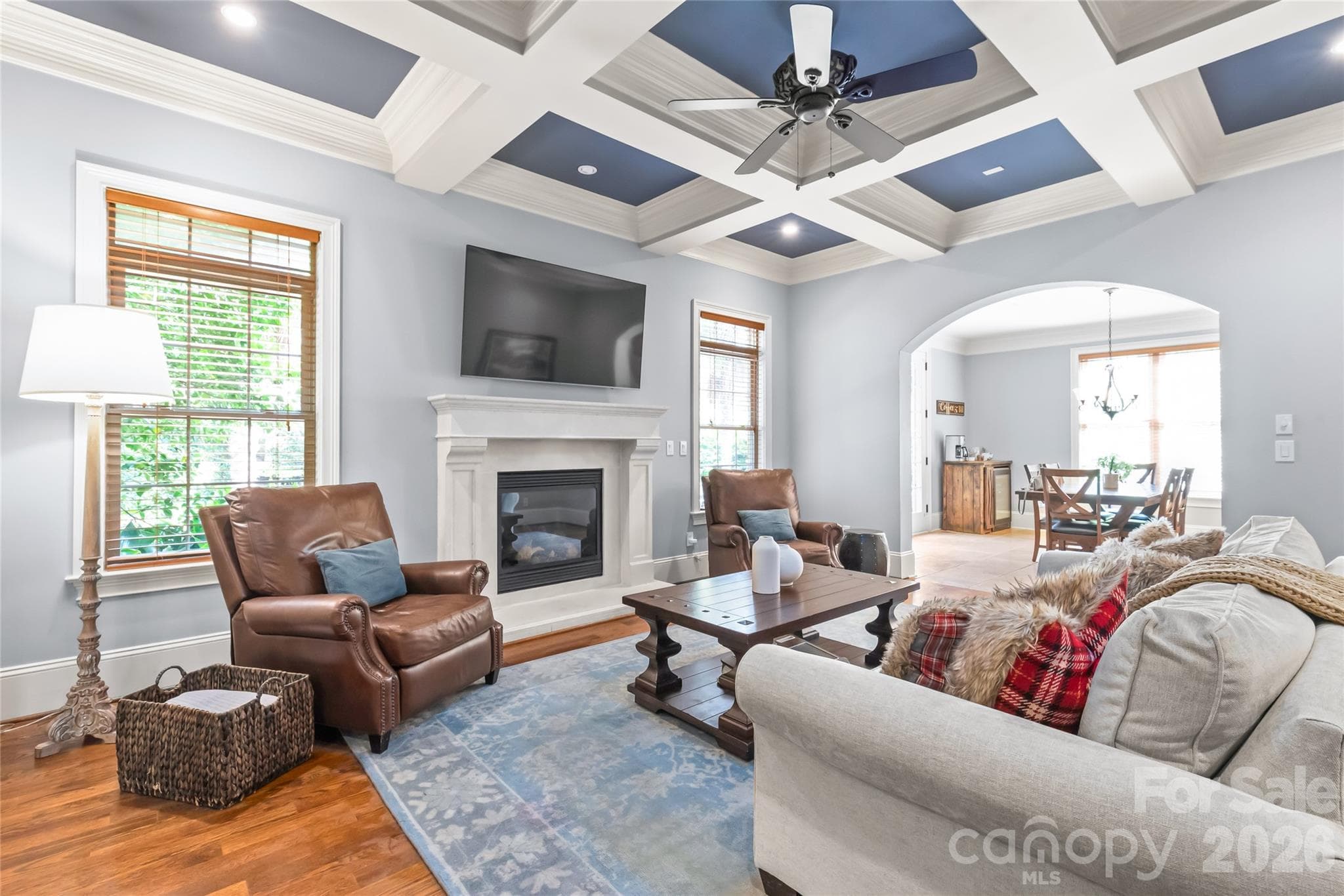 Intricately detailed coffered ceilings add architectural depth and timeless warmth to the space. - 7320 Summerlin Place, Charlotte