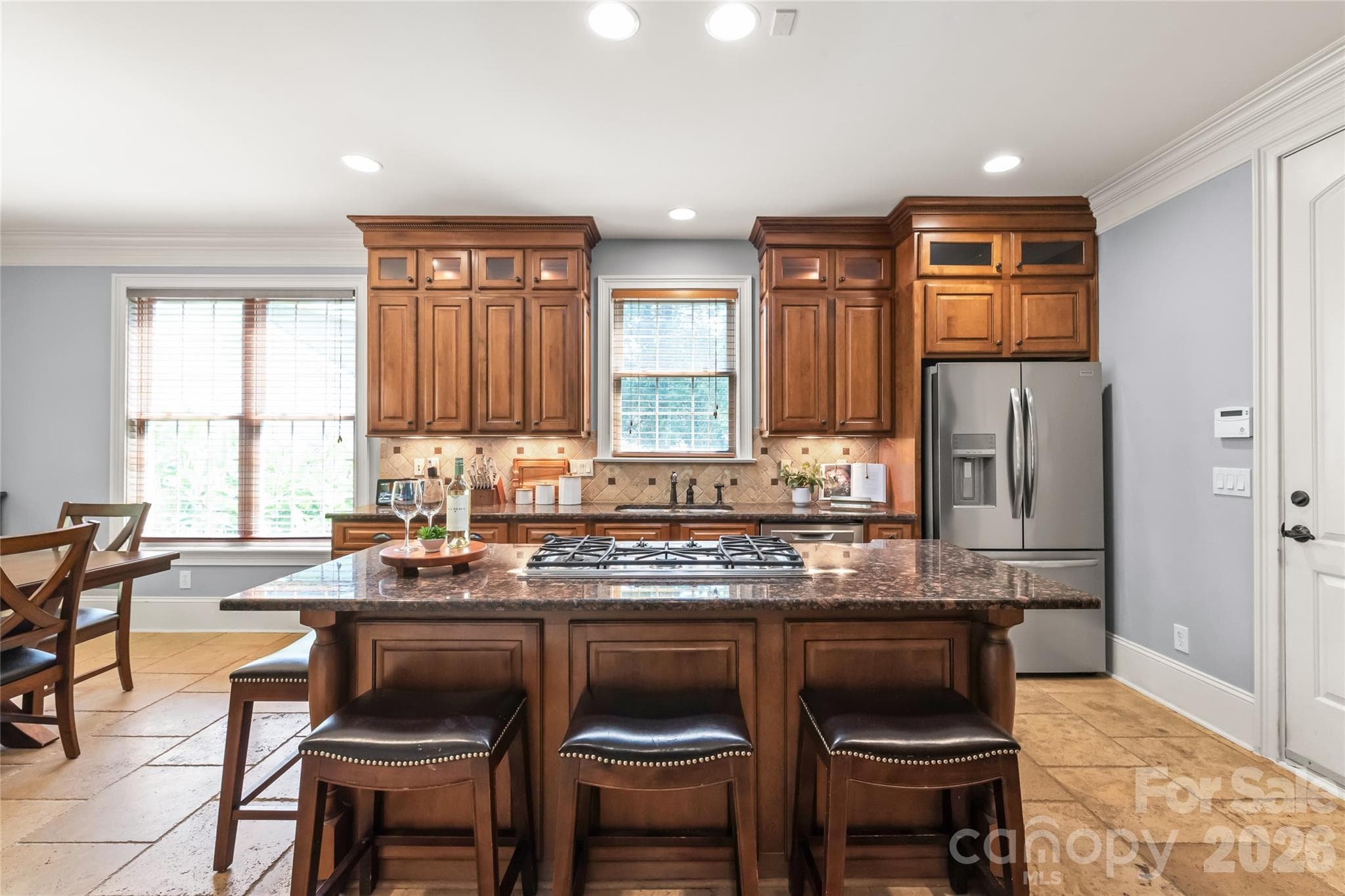 Equipped for modern living with a newly updated wall oven (2024) and stainless steel dishwasher (2025). - 7320 Summerlin Place, Charlotte