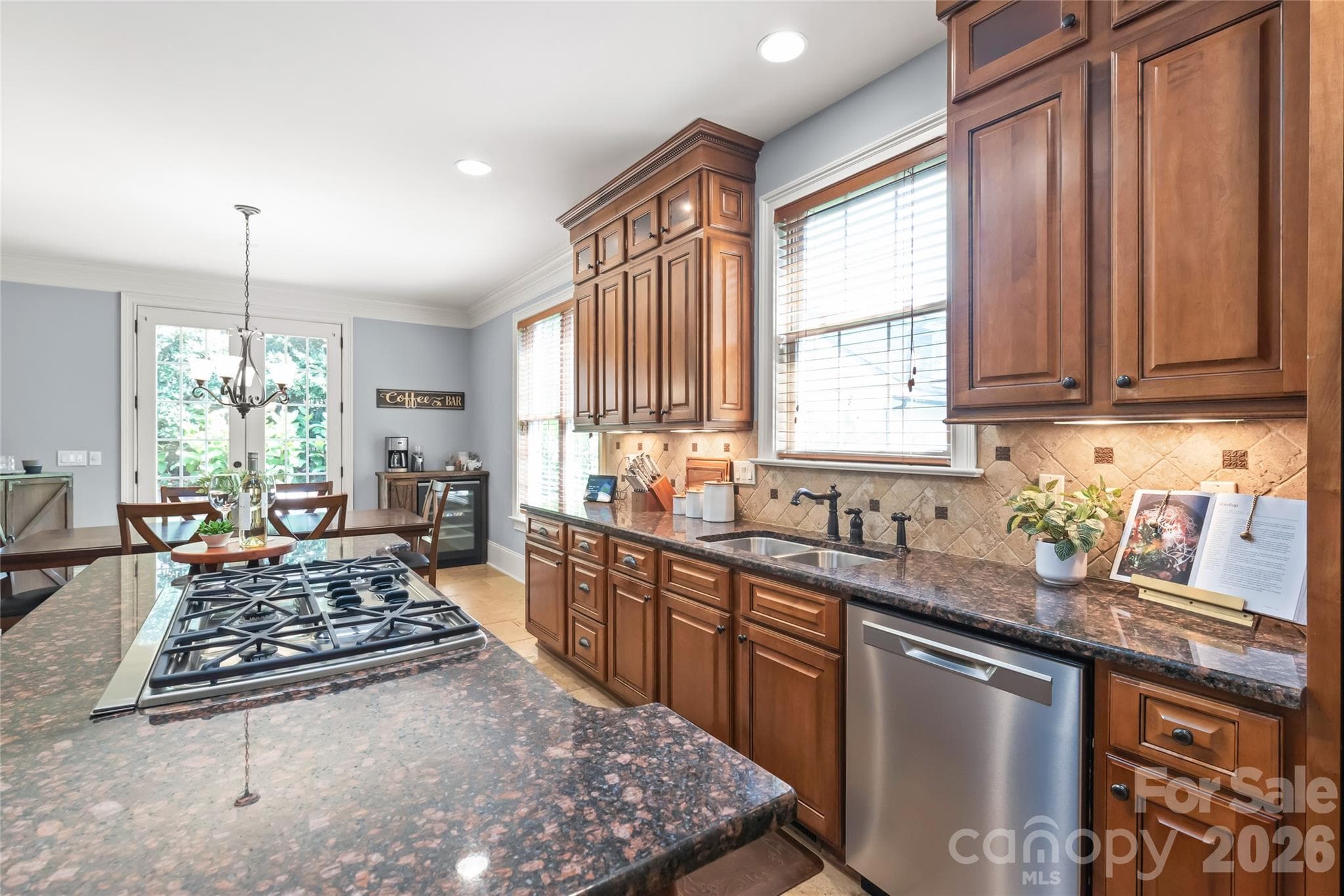 Abundant floor-to-ceiling cabinetry offers exceptional storage to keep your kitchen effortless and organized. - 7320 Summerlin Place, Charlotte