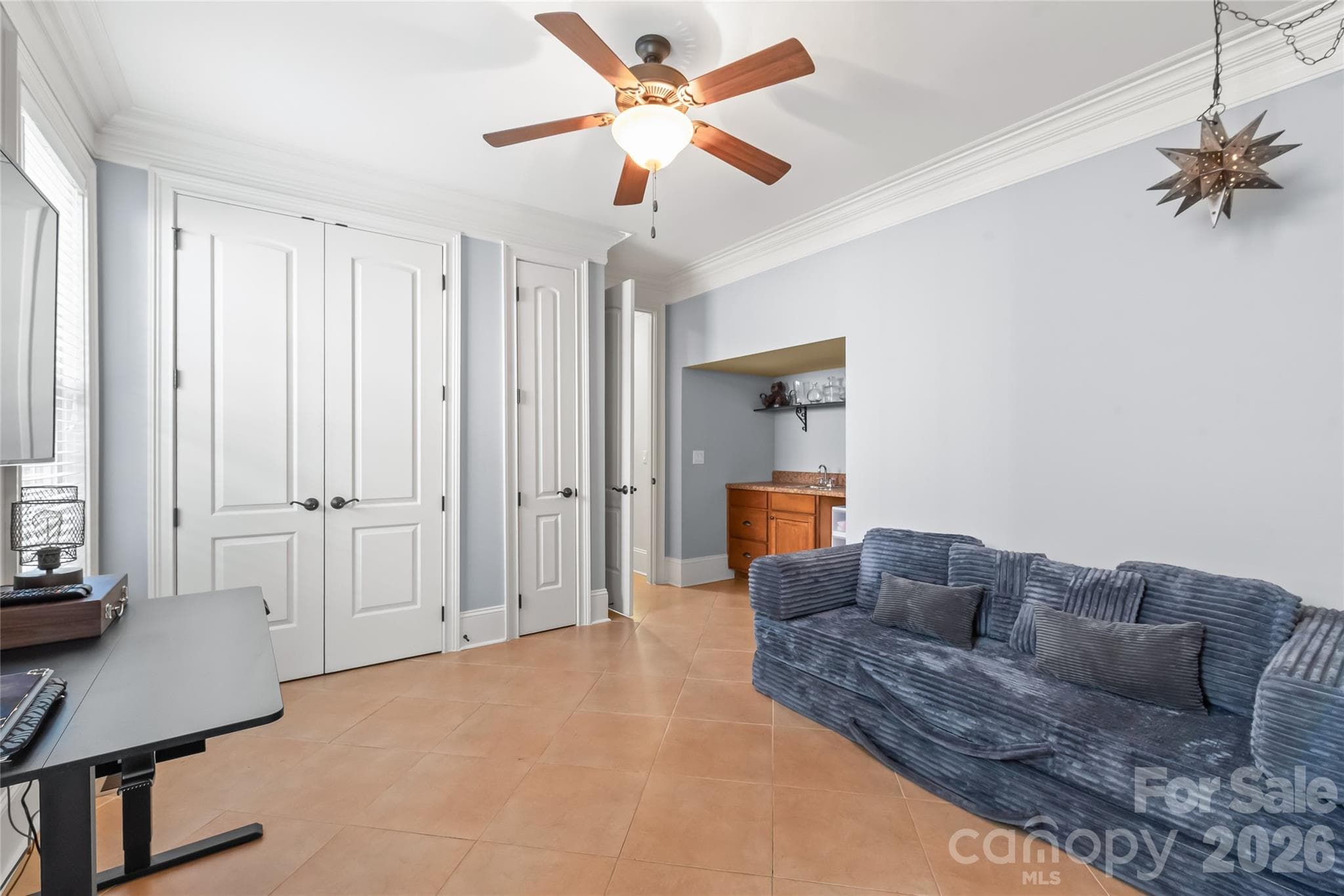 Eight-foot solid interior doors frame this space, complete with a wet bar and a private entrance for effortless entertaining or guest access. - 7320 Summerlin Place, Charlotte