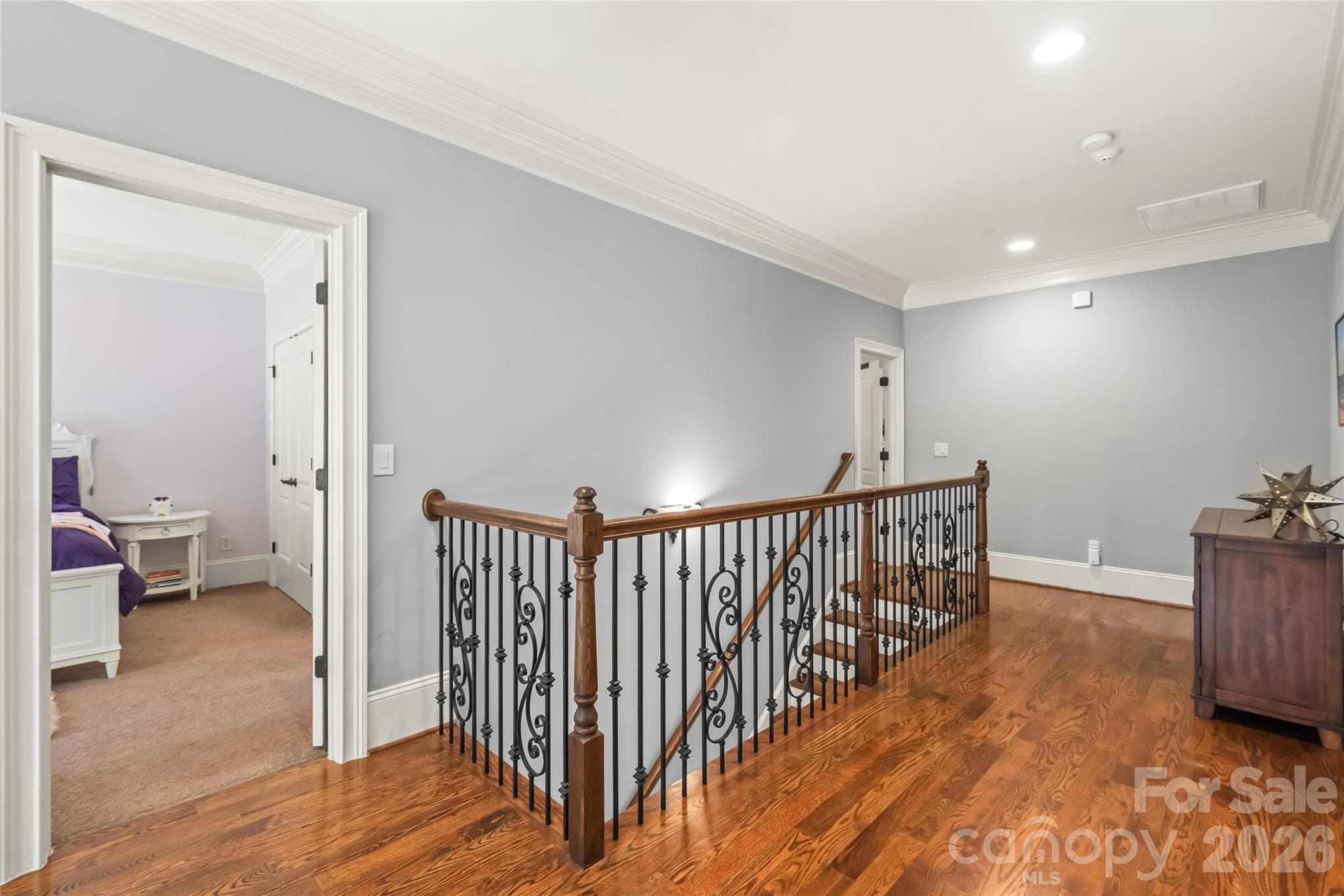The second level features four spacious bedrooms, a convenient laundry room, and a versatile bonus space ideal for movie and game nights. - 7320 Summerlin Place, Charlotte