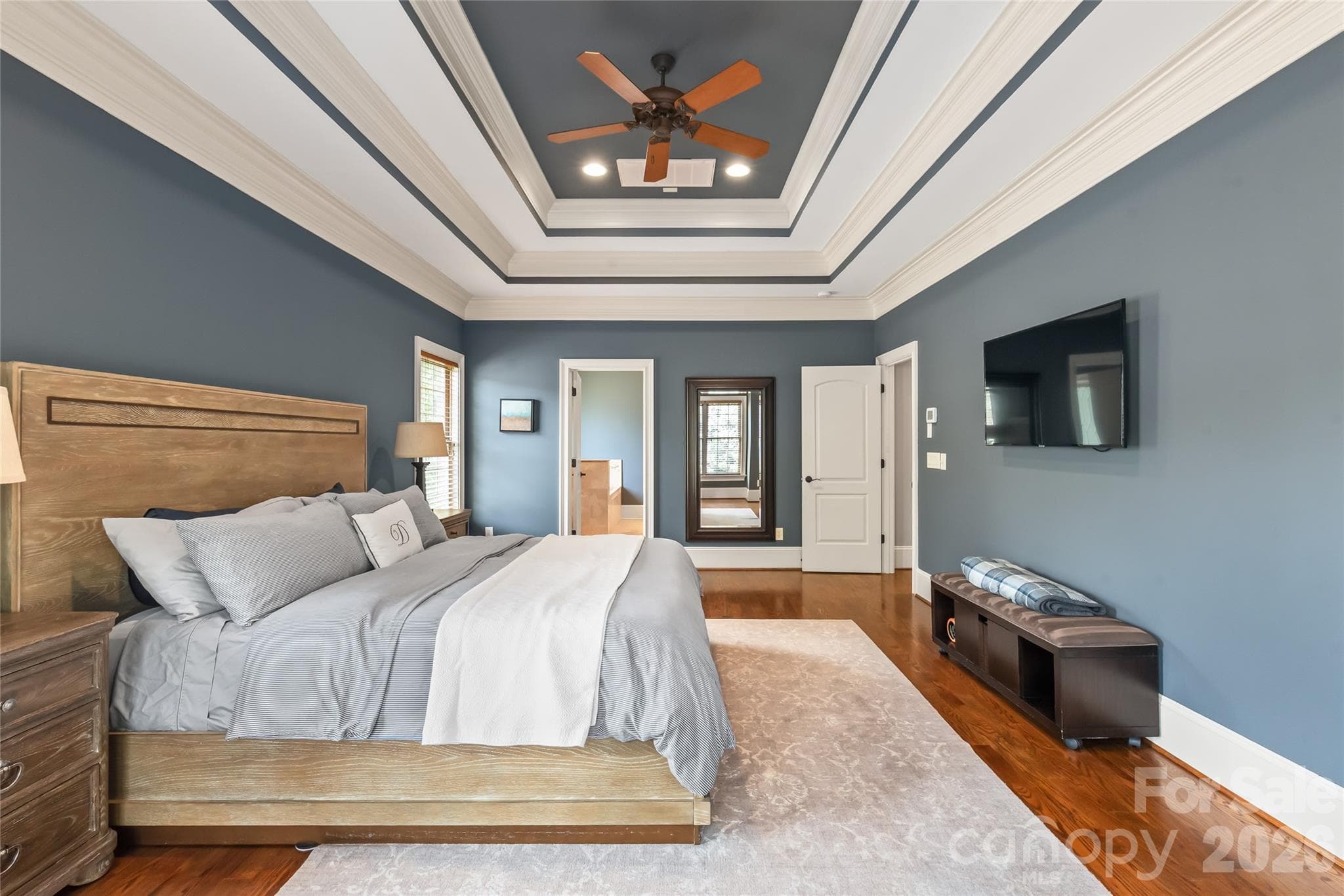 A spacious primary bedroom complete with a luxurious en-suite bath creates a serene and private retreat. - 7320 Summerlin Place, Charlotte