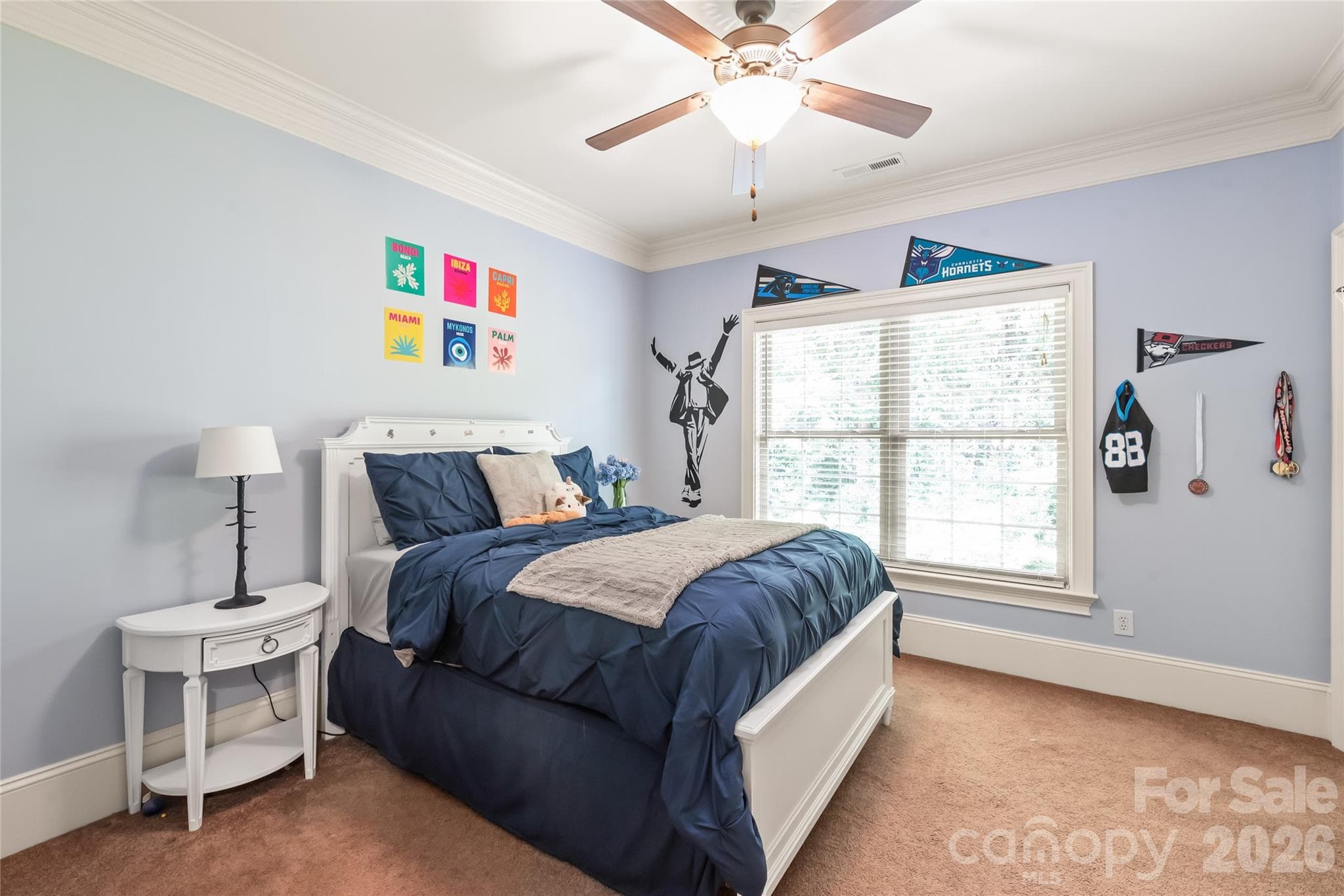 Bedroom 2 features its own walk-in closet and direct access to a convenient Jack-and-Jill bath. - 7320 Summerlin Place, Charlotte