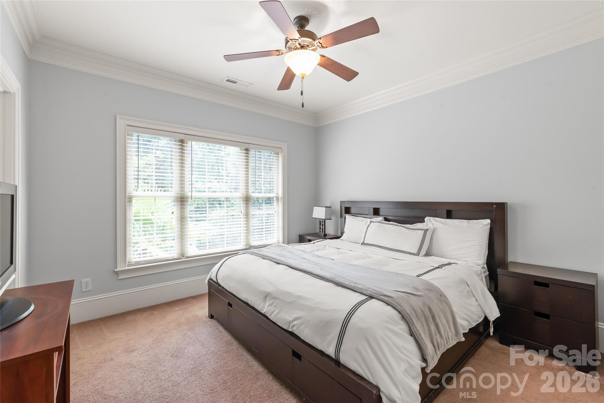 Bedroom four functions as a private suite, featuring its own dedicated full bath and closet. - 7320 Summerlin Place, Charlotte