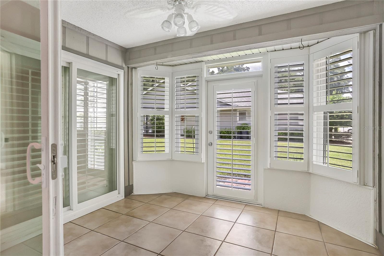 Newer insulated windows and plantation shutters along with newer sliders. - 605 CHESTNUT OAK CIR #107, ALTAMONTE SPRINGS