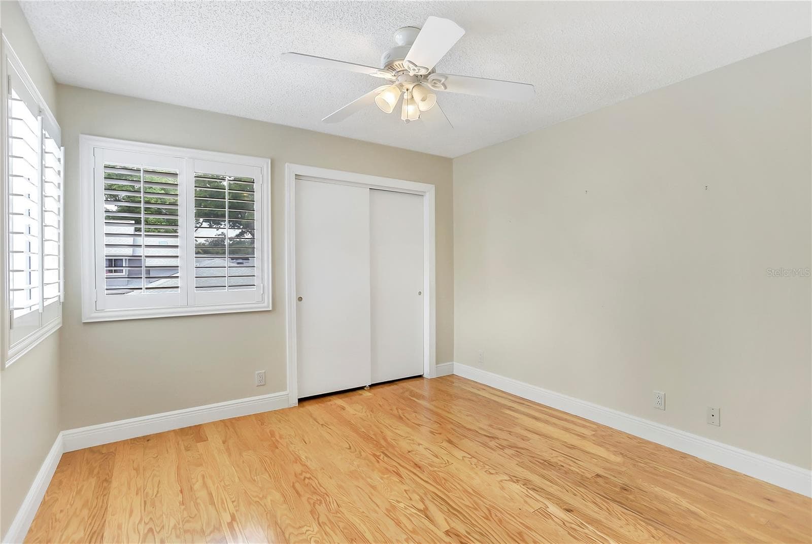 Upstairs bedroom 2 with engineered wood floors. - 605 CHESTNUT OAK CIR #107, ALTAMONTE SPRINGS