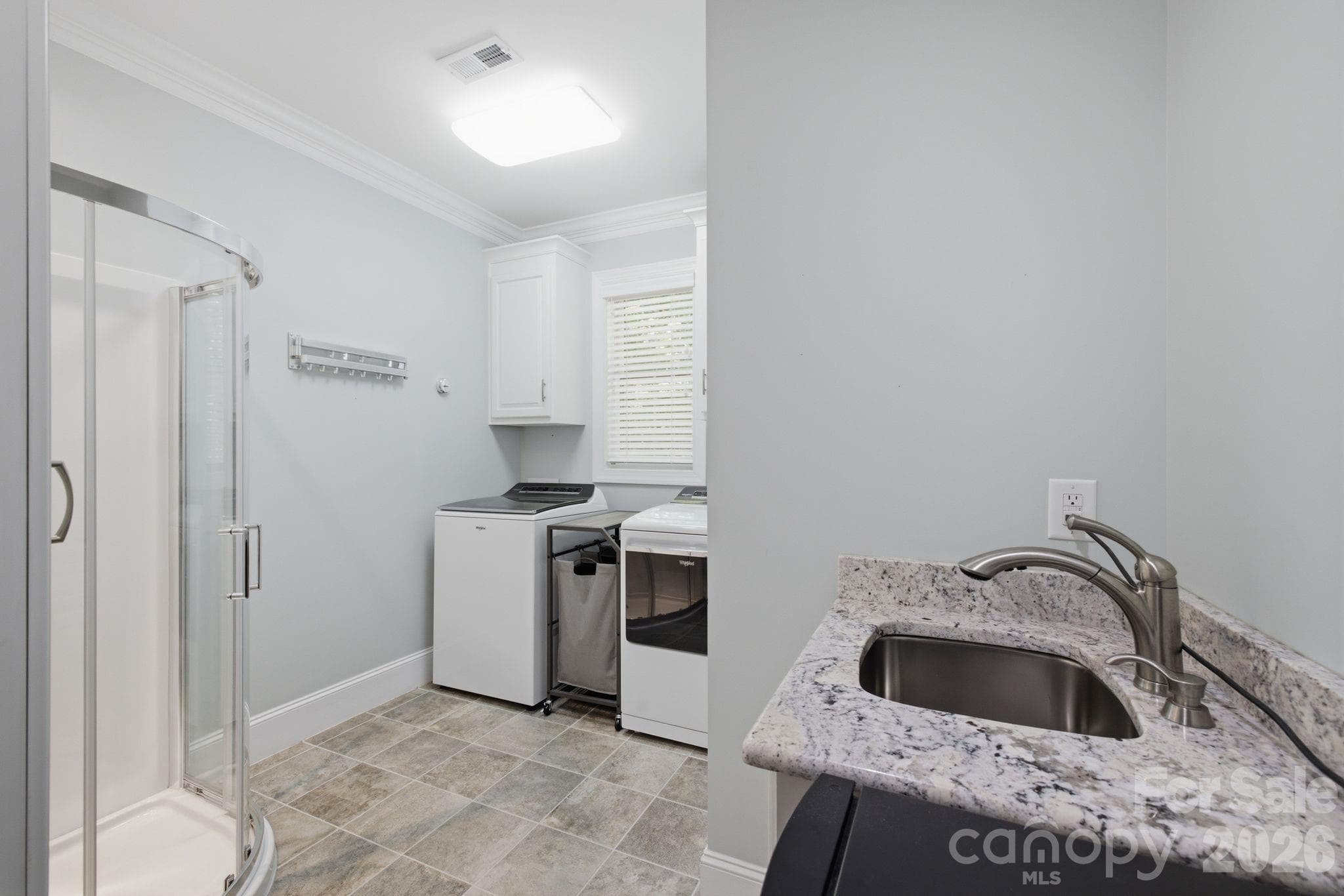 Large laundry room with sink and shower which is perfect for bathing the pets! - 7197 Windy Ridge Drive, Iron Station