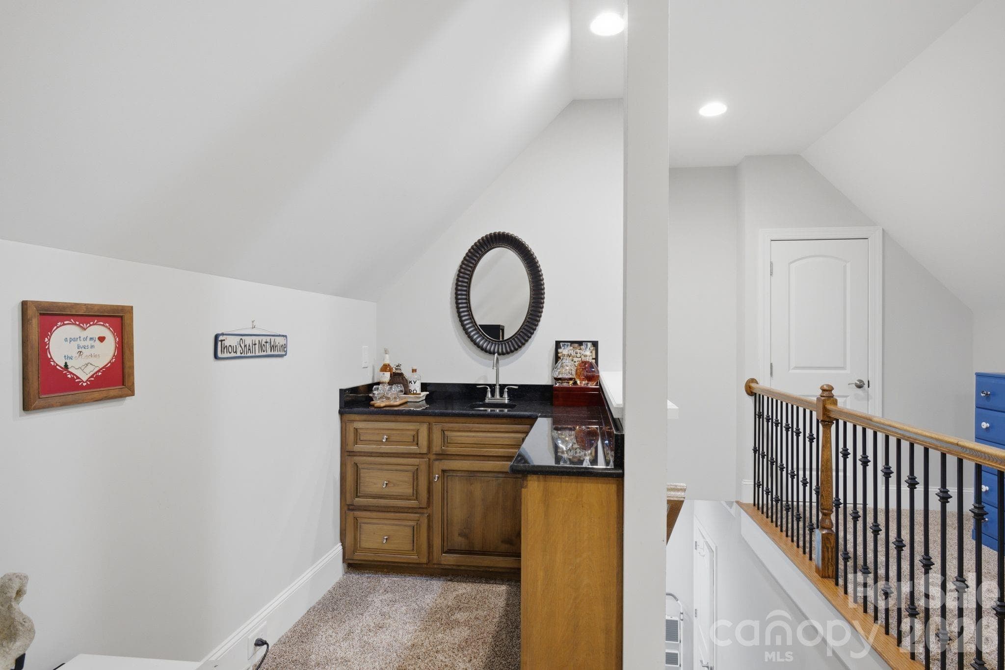 Bar in the bonus room increases the functionality - 7197 Windy Ridge Drive, Iron Station