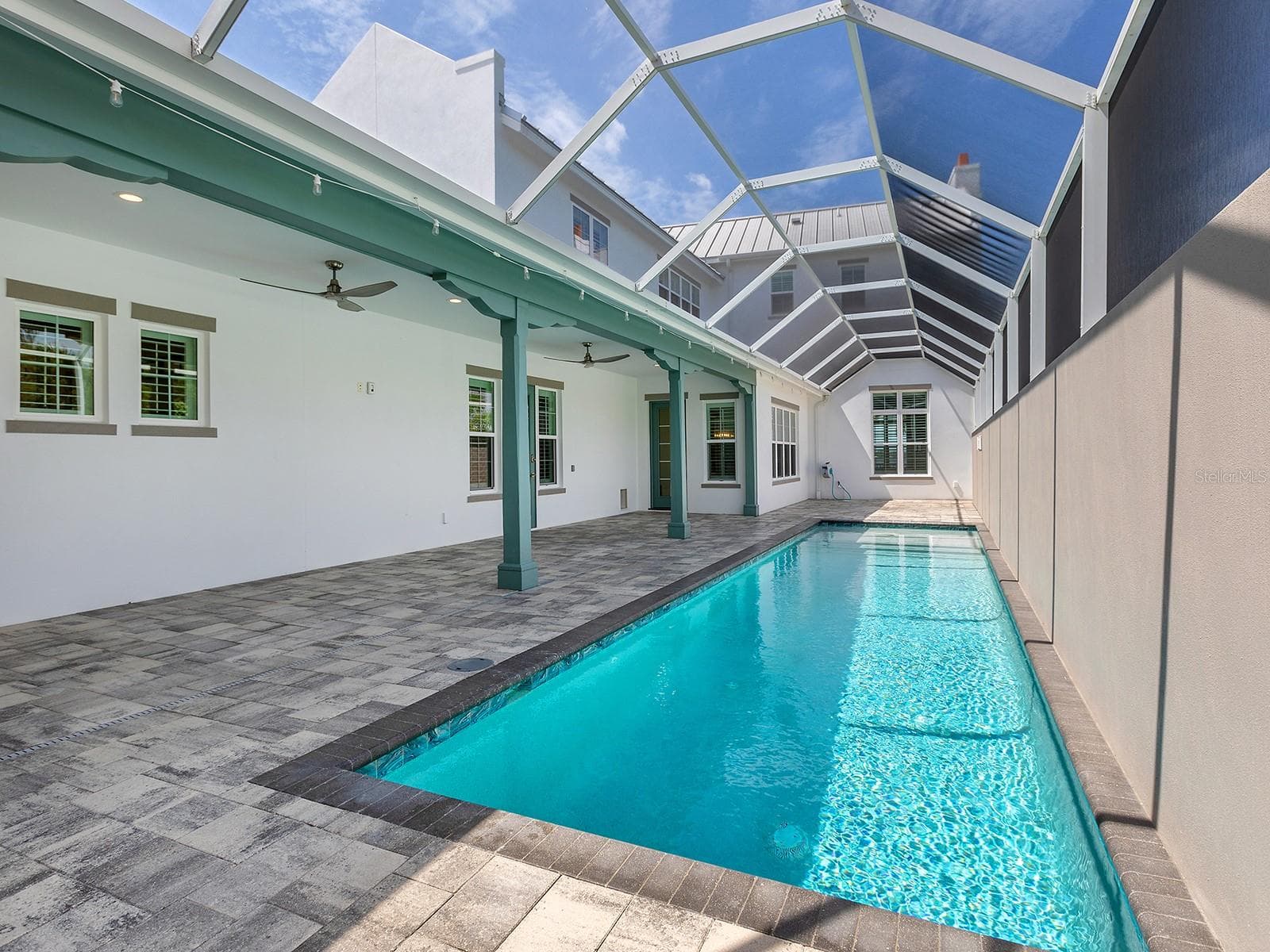 Above the 38-foot heated saltwater pool is the nearly 800 square foot in-law suite - 4024 11TH STREET CT W, PALMETTO