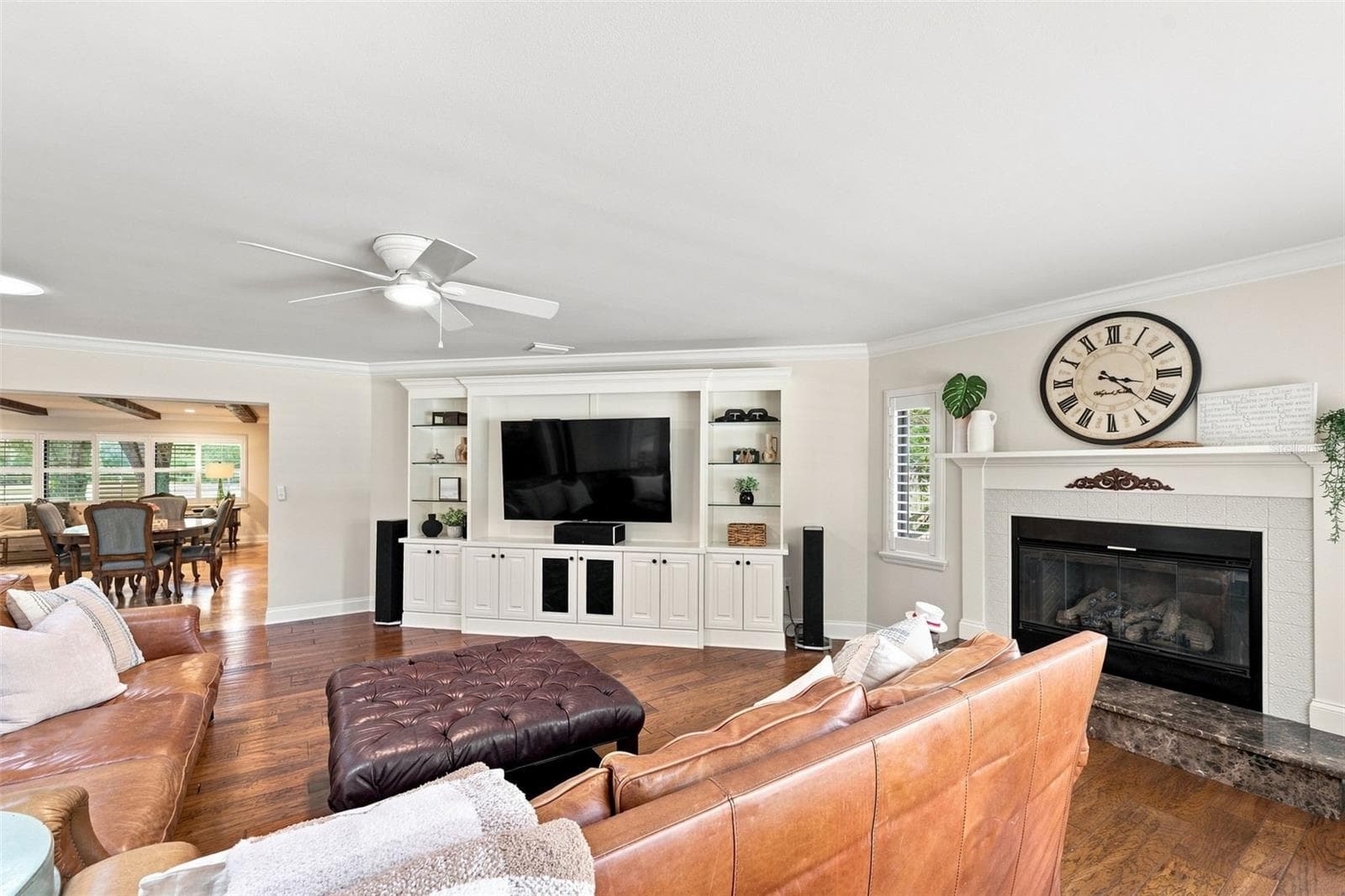 The family room opens off the Kitchen and features expansive views of the backyard and a cozy fireplace. - 13123 108TH AVE, LARGO