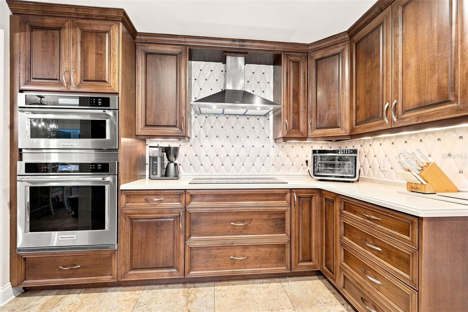 The beautifully appointed kitchen has high-end soft-close cabinetry and stainless appliances. - 13123 108TH AVE, LARGO