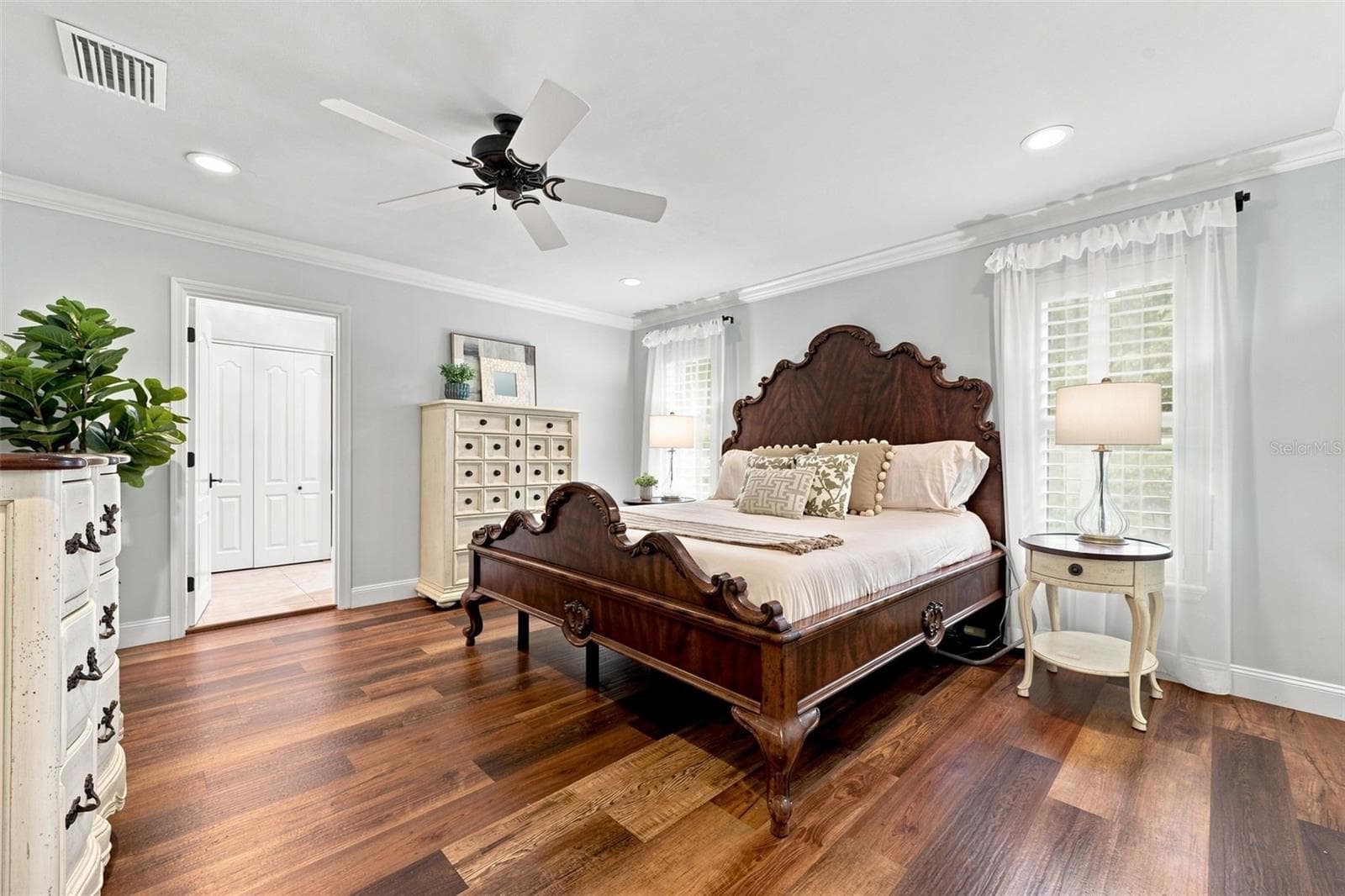 The primary suite features a large walk-in closet with an updated bedroom and en-suite bath (2022) - 13123 108TH AVE, LARGO