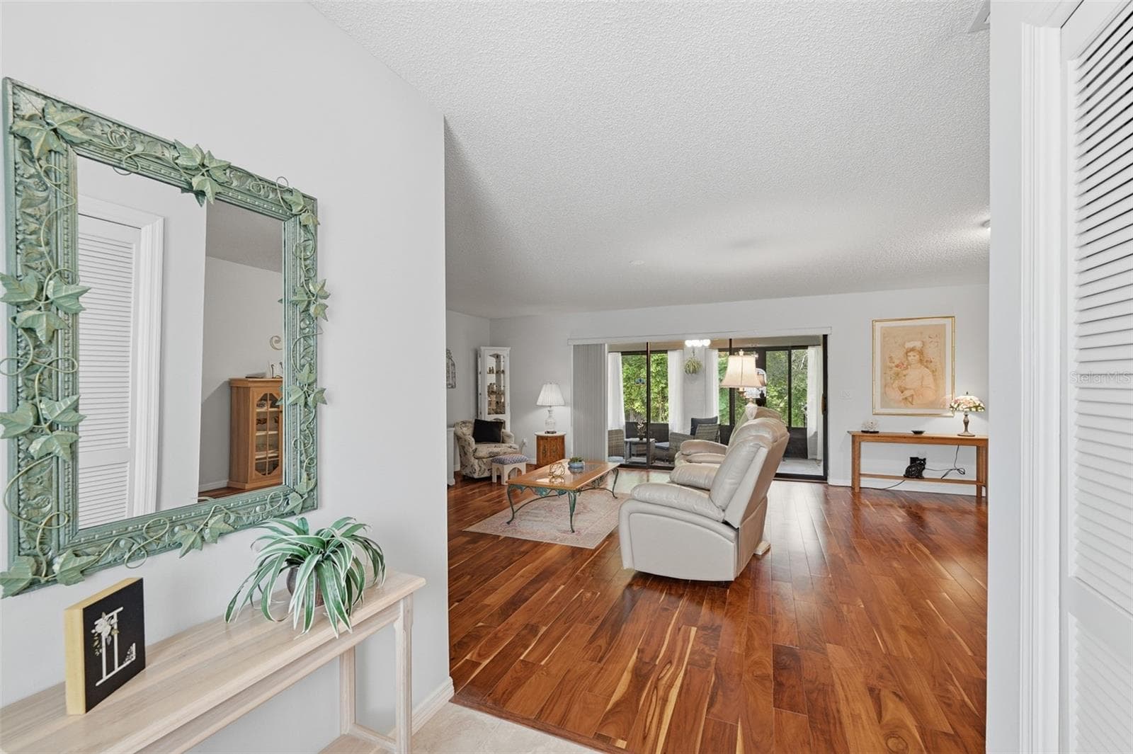 FOYER LOOKING INTO GREAT ROOM. PLENTY OF ROOM FOR DINING TABLE AND CHAIRS IF YOU WISH. - 1803 NEW BEDFORD DR, SUN CITY CENTER